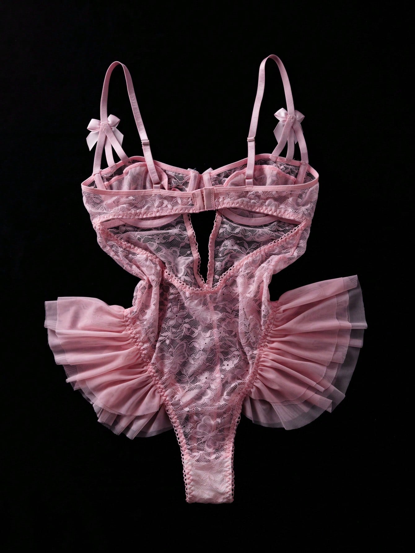 Women’s butterfly lace and mesh lingerie jumpsuit with ruffled trim, underwire cups, bow detail, cut-out accents, sheer fabric, and adjustable spaghetti straps.