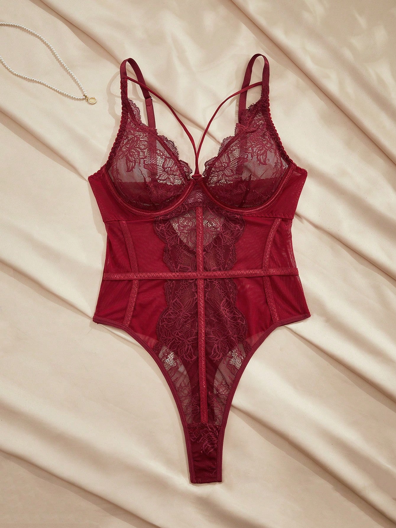 Women's underwire teddy bodysuit with contrast lace and mesh patchwork, adjustable spaghetti straps, sheer details, and 3/4 cup design.