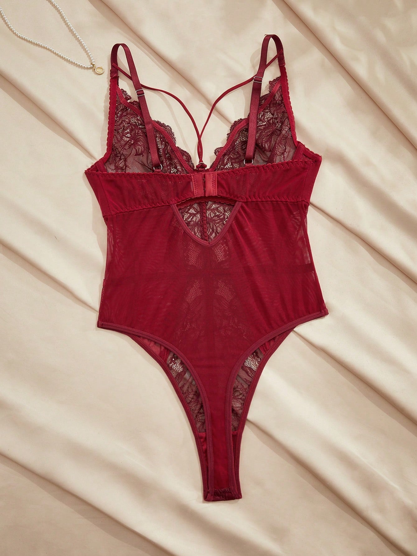 Women's underwire teddy bodysuit with contrast lace and mesh patchwork, adjustable spaghetti straps, sheer details, and 3/4 cup design.