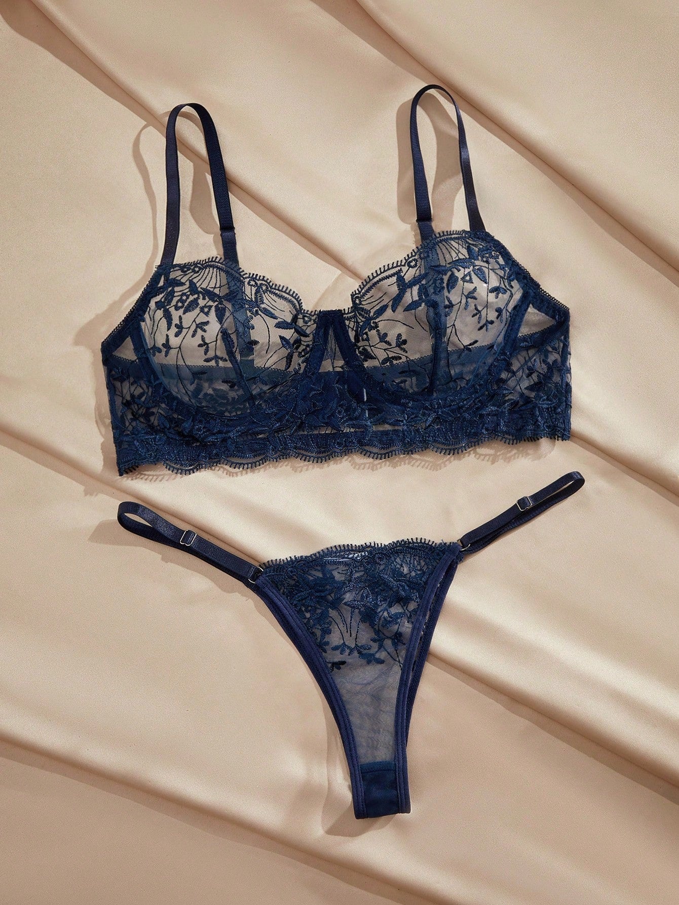 Navy blue floral embroidery mesh underwire lingerie set with contrast lace, adjustable spaghetti straps, camisole-style bra, and low-rise thong panty