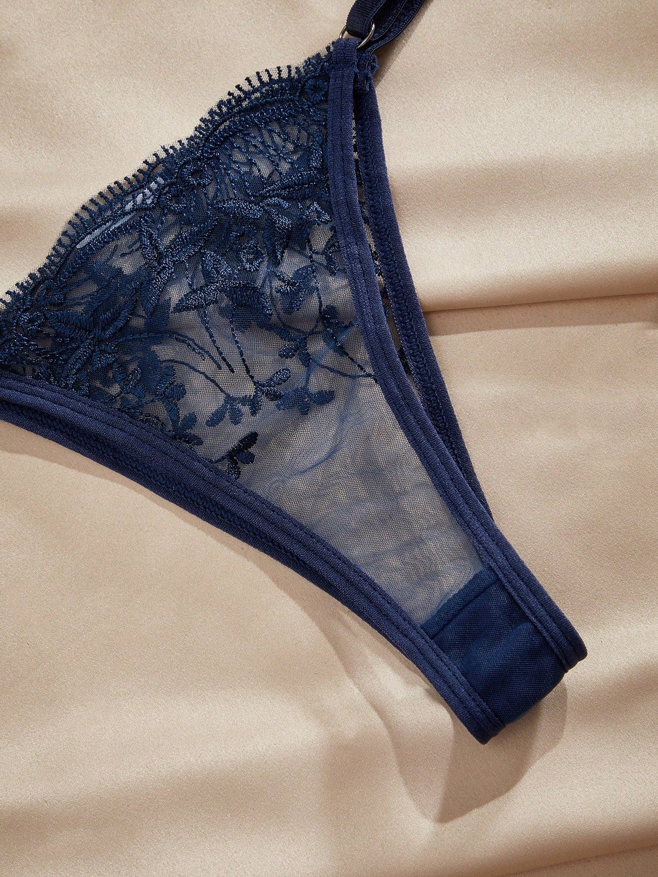 Navy blue floral embroidery mesh underwire lingerie set with contrast lace, adjustable spaghetti straps, camisole-style bra, and low-rise thong panty