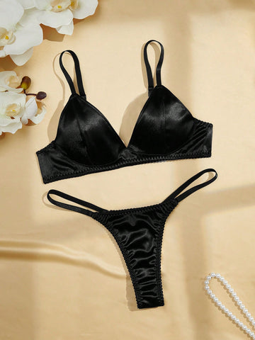 Black 2-piece lingerie set with a wireless bralette featuring adjustable straps and matching low-rise thong