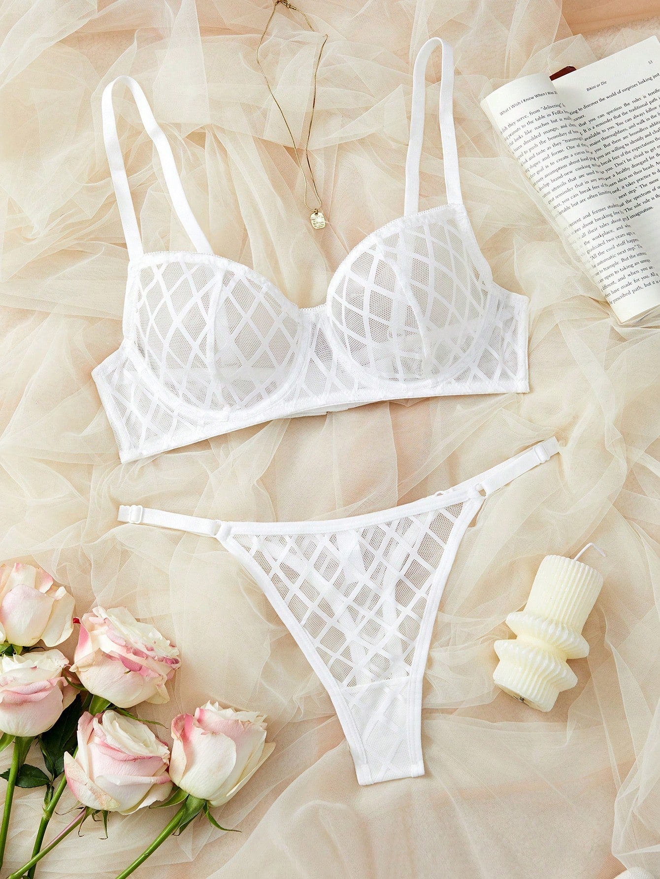 Two-piece sheer mesh lingerie set featuring a balconette bra and matching low-rise thong, with cut-out detailing and adjustable straps in a minimalist romantic style.