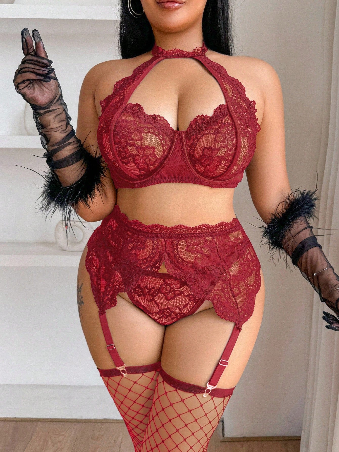Plus size 5-piece lace lingerie set featuring a halter underwire top with adjustable straps, garter belt, thong-style G-string, and one pair of thigh-high fishnet stockings.
