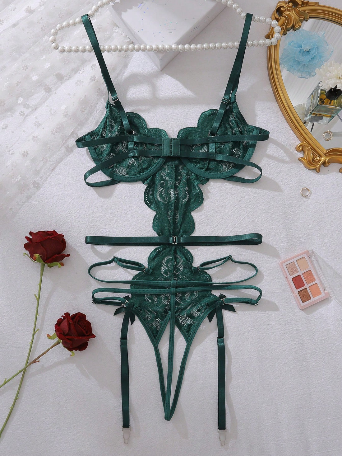 Dark green floral lace backless teddy bodysuit lingerie with sheer unlined fabric, scalloped trim, cut-out details, adjustable spaghetti straps, triangle cups, wireless bralette style, high-rise V-string design, and removable padding.