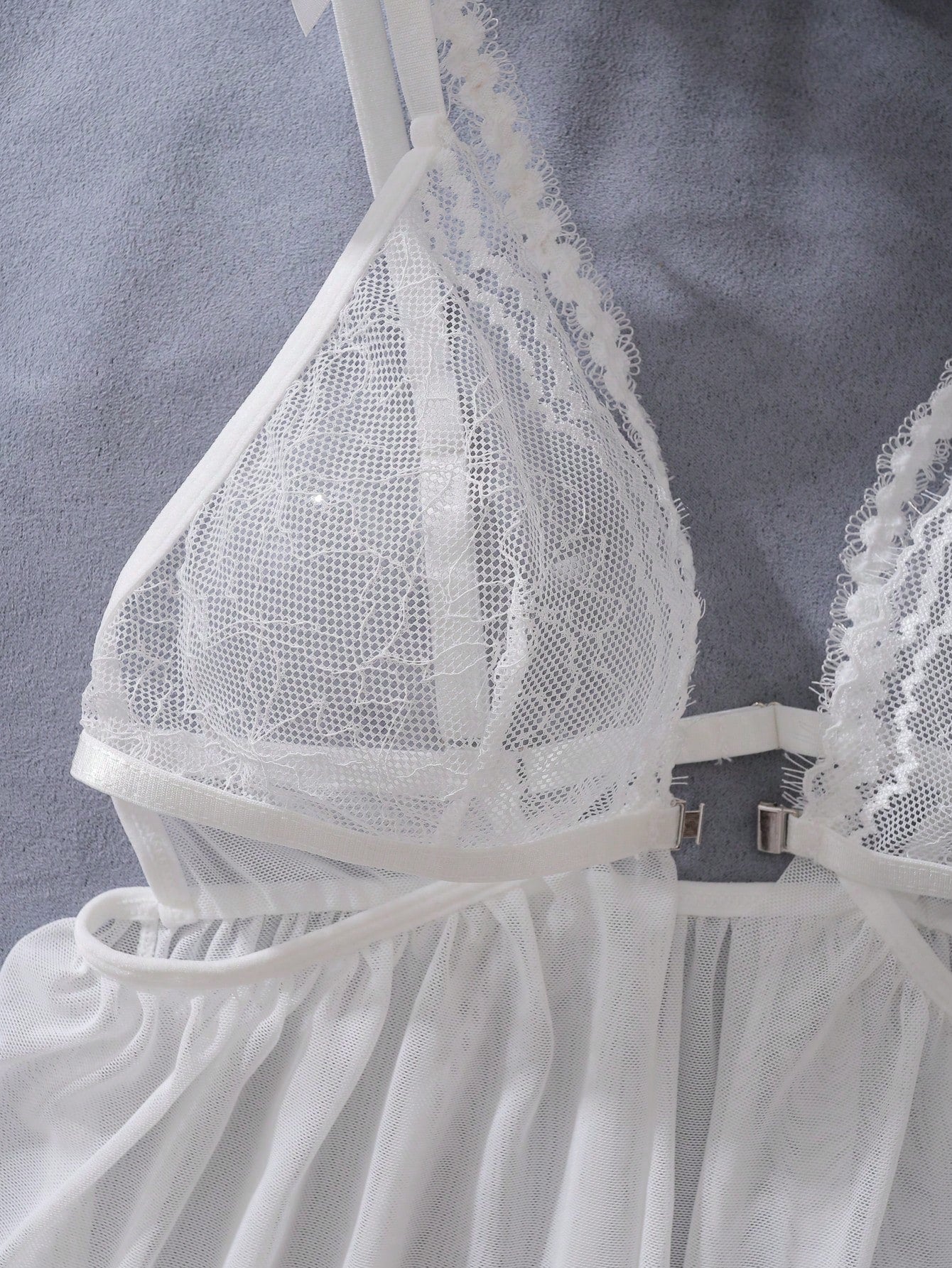 Women’s 2-piece lingerie set featuring a romantic lace patchwork babydoll nightgown with spaghetti straps, bow and cut-out details, and a matching low-rise thong.