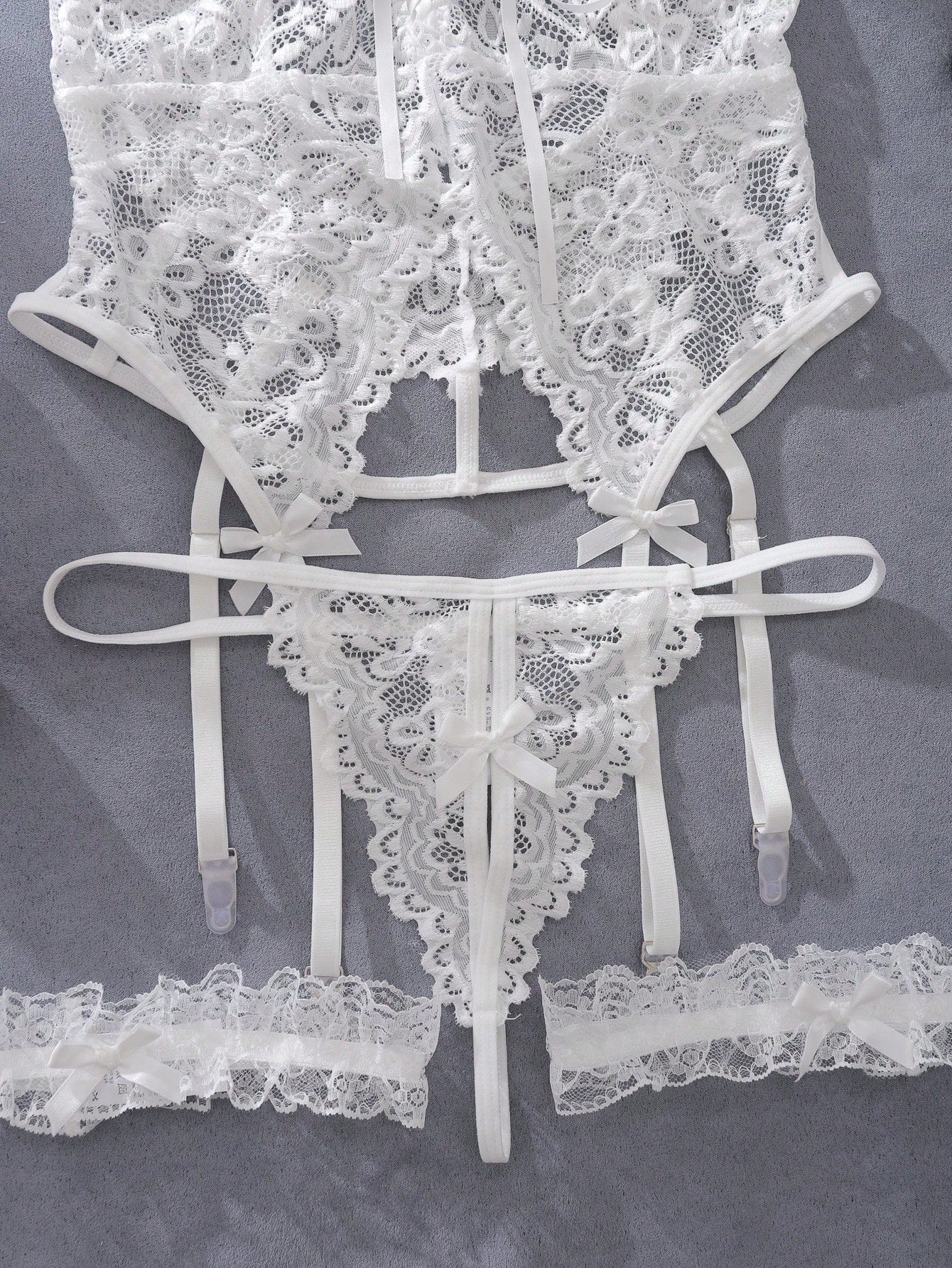 Floral lace underwire garter corset lingerie set with adjustable spaghetti straps, backless bra, V-string panty, and one pair of leg rings.
