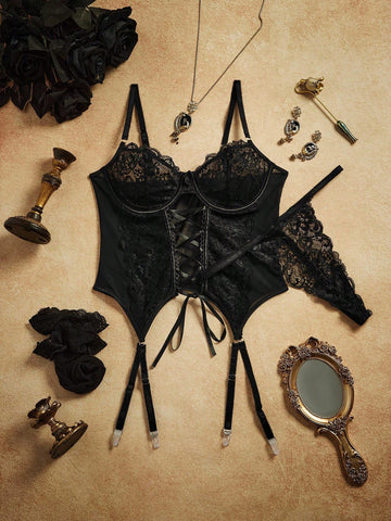 Four-piece lingerie set featuring an underwire corset with lace-up front, contrast mesh and lace detailing, adjustable spaghetti straps, and matching thong-style bottoms with garter accents.