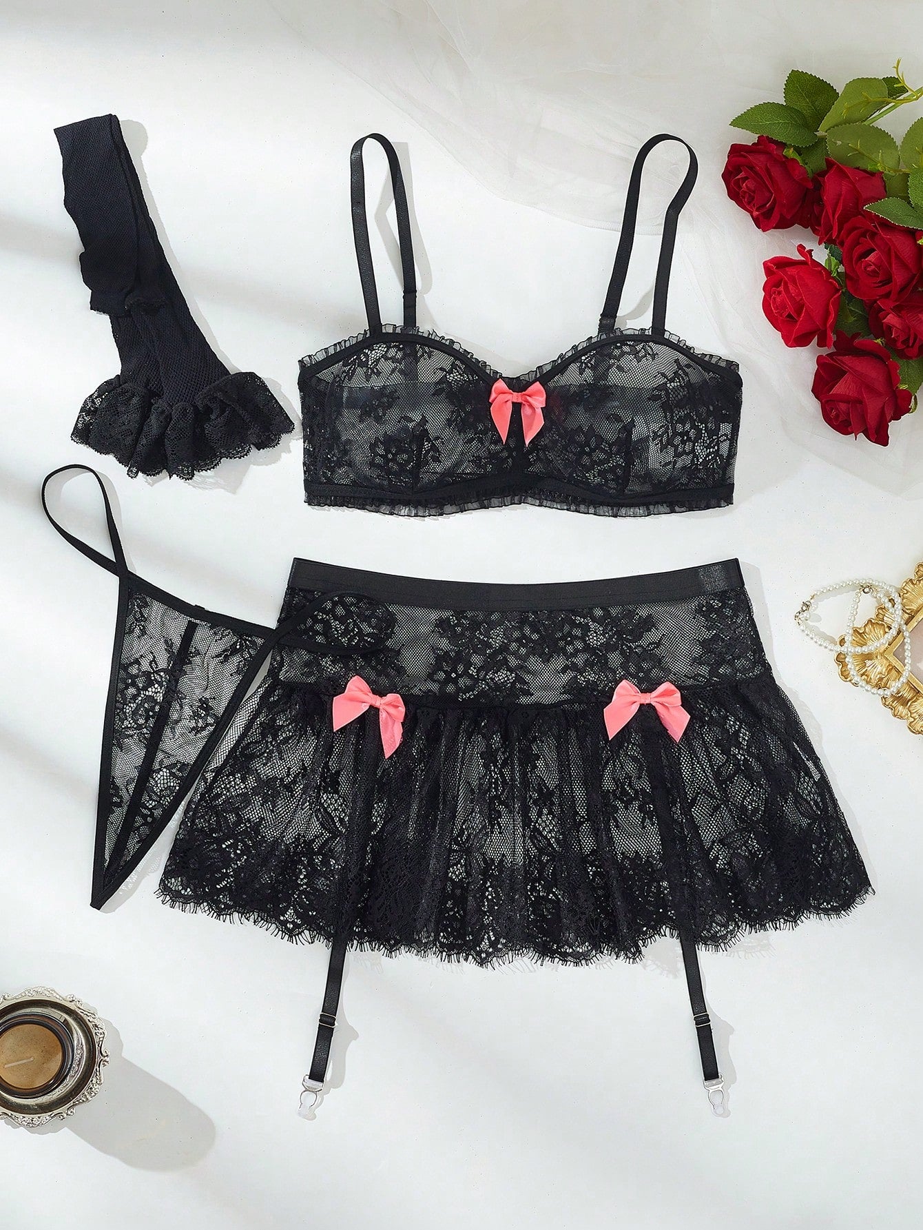 Women’s 5-piece romantic lace lingerie set featuring a sheer bralette with adjustable spaghetti straps, mini skirt, thong, and stockings with contrast lace and bow details.