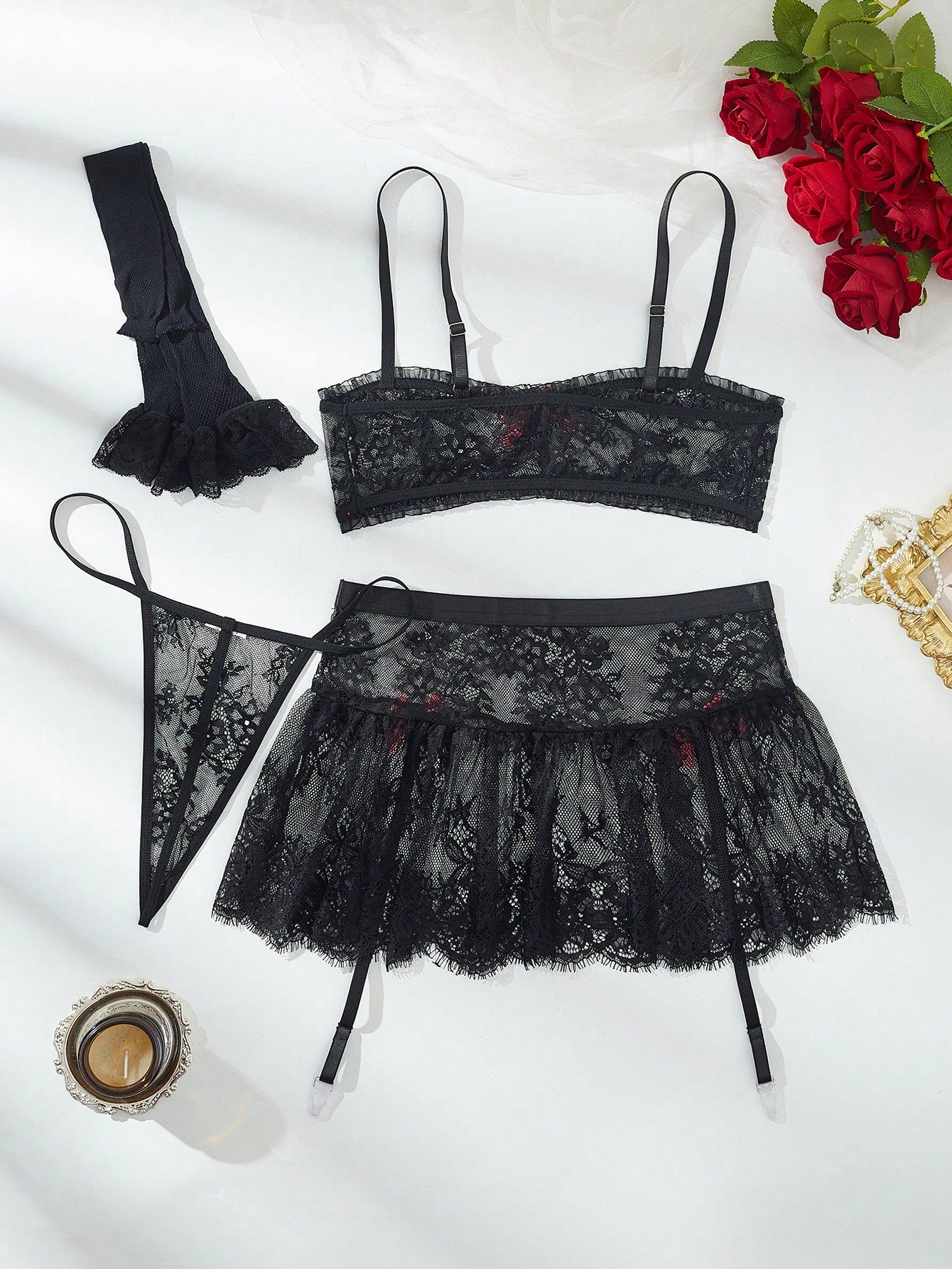Women’s 5-piece romantic lace lingerie set featuring a sheer bralette with adjustable spaghetti straps, mini skirt, thong, and stockings with contrast lace and bow details.