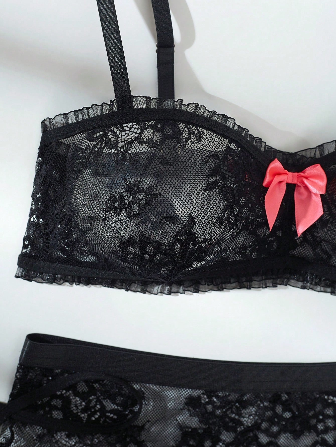 Women’s 5-piece romantic lace lingerie set featuring a sheer bralette with adjustable spaghetti straps, mini skirt, thong, and stockings with contrast lace and bow details.
