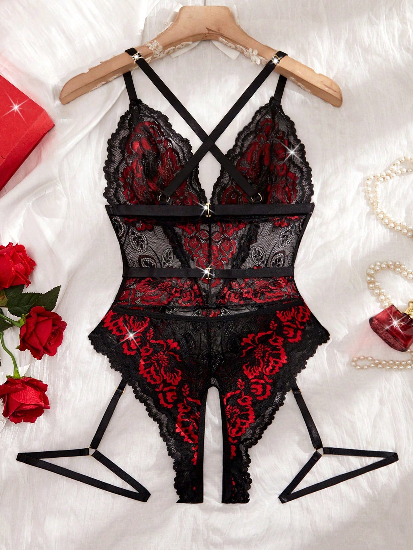 Two-piece women’s sexy lace bodysuit set with contrast lace, cut-out details, crossback spaghetti straps, and thong-style bottoms; wireless design with slight stretch, shown in multicolor with plant/random print accents.