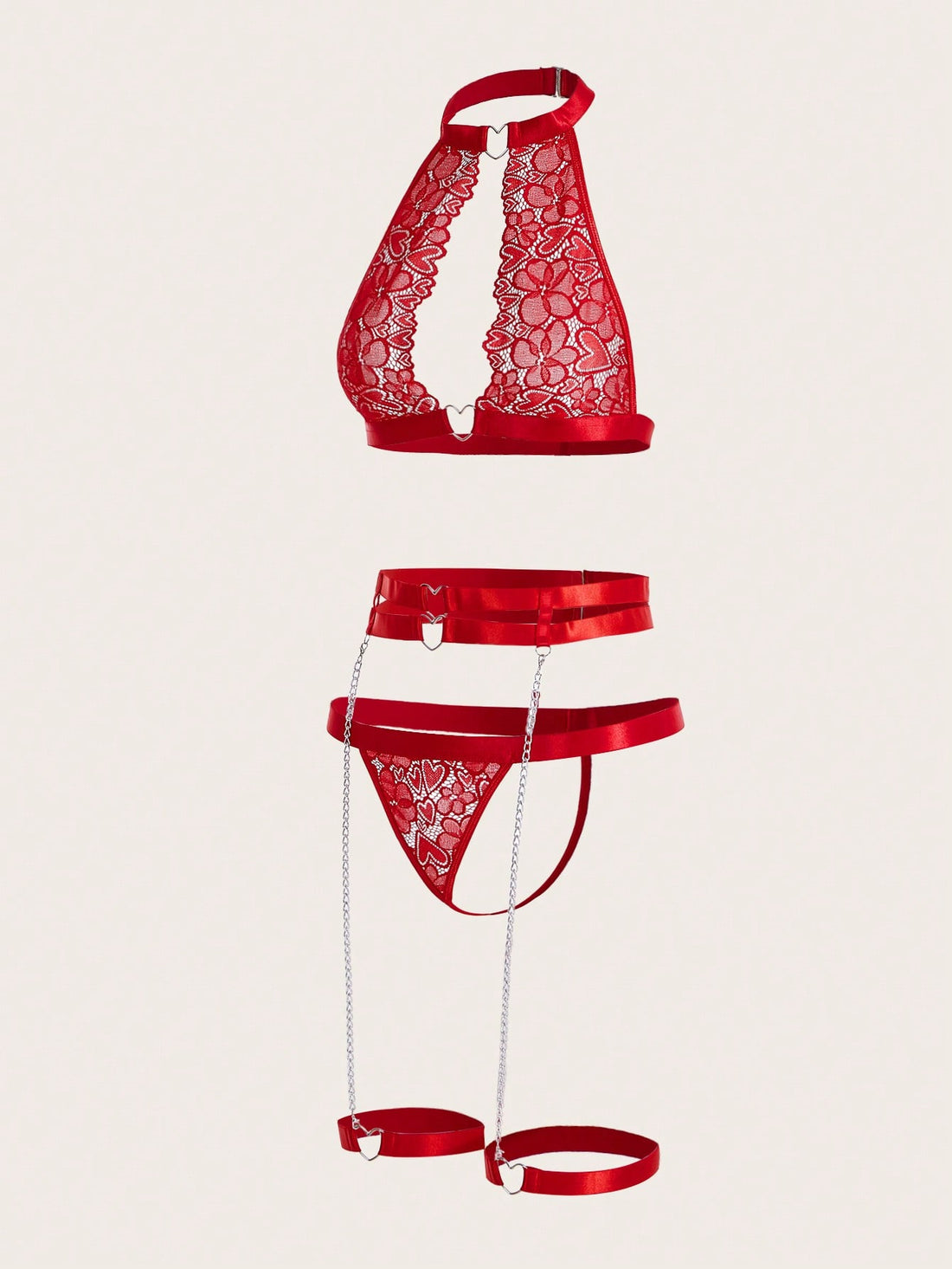 Four-piece floral lace lingerie set with heart ring link details, including a halter bralette with adjustable straps, matching V-string panty, and garter pieces with chain accents and a backless design.