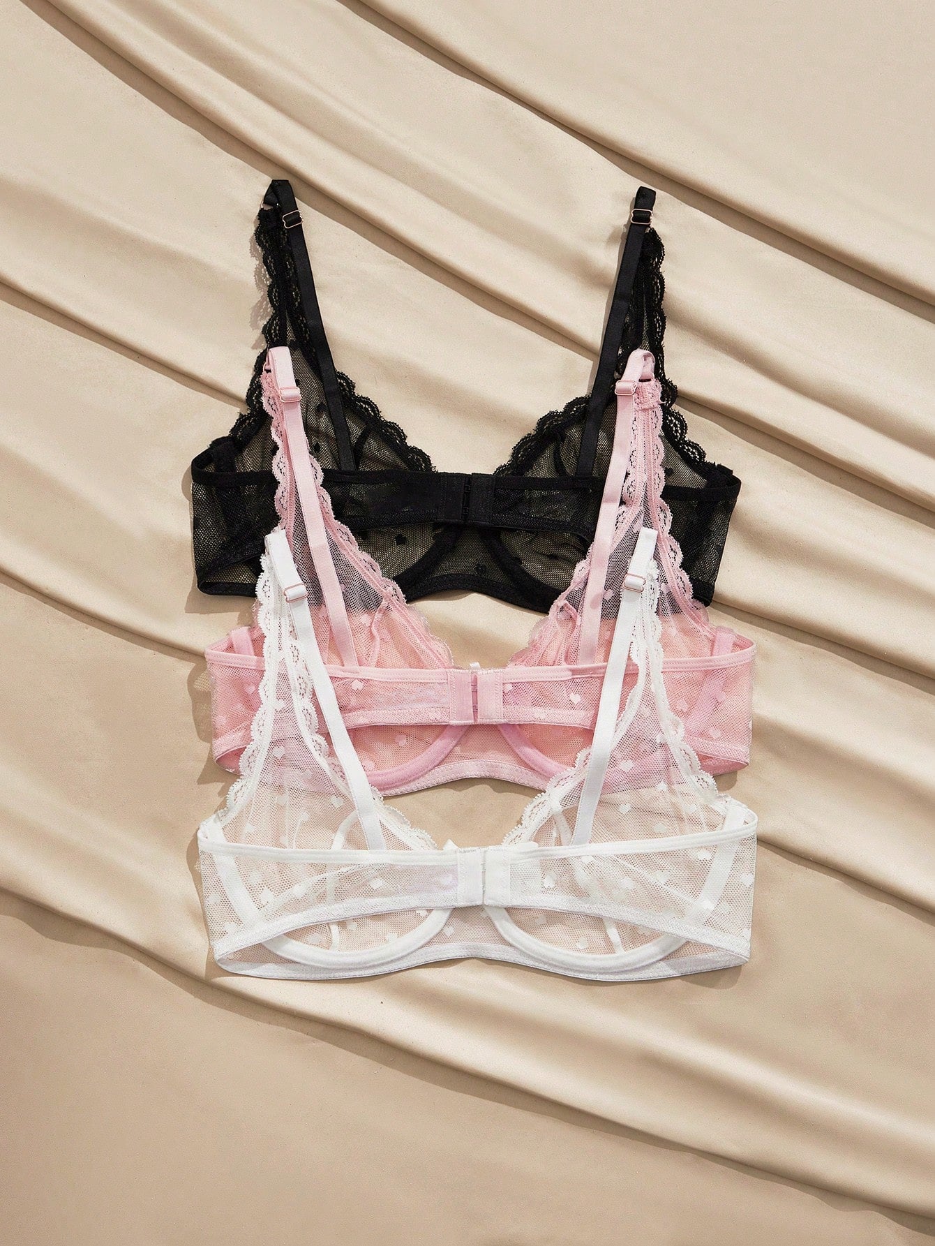 Women's solid color lace bra with sheer unlined design, bow detail, underwire support, and adjustable straps; romantic style push-up bralette for daily wear.