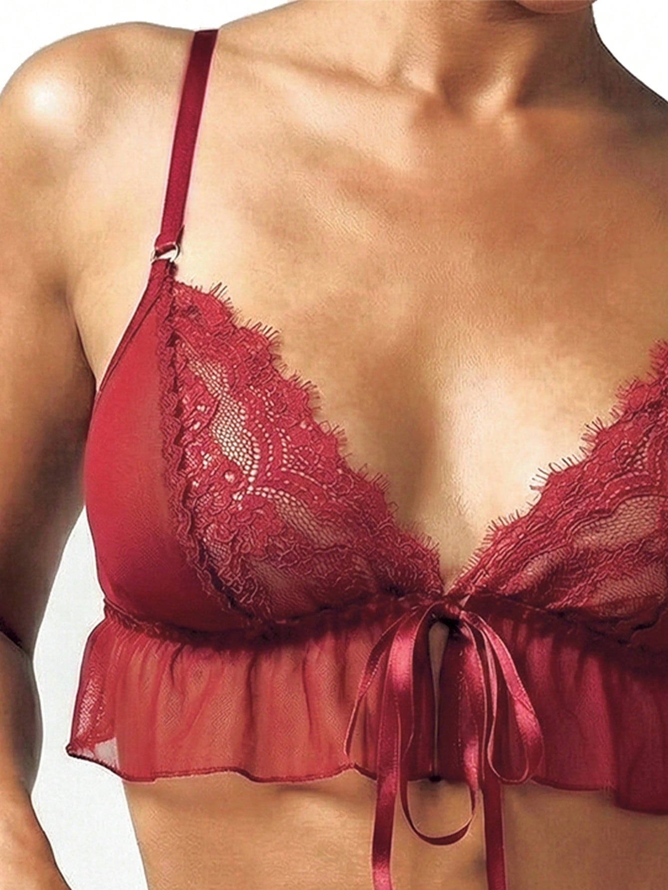 Two-piece women’s lingerie set featuring a sheer mesh lace ruffle bralette with triangle plunge cups, adjustable straps, backless tie-front design, and a matching mid-rise thong.