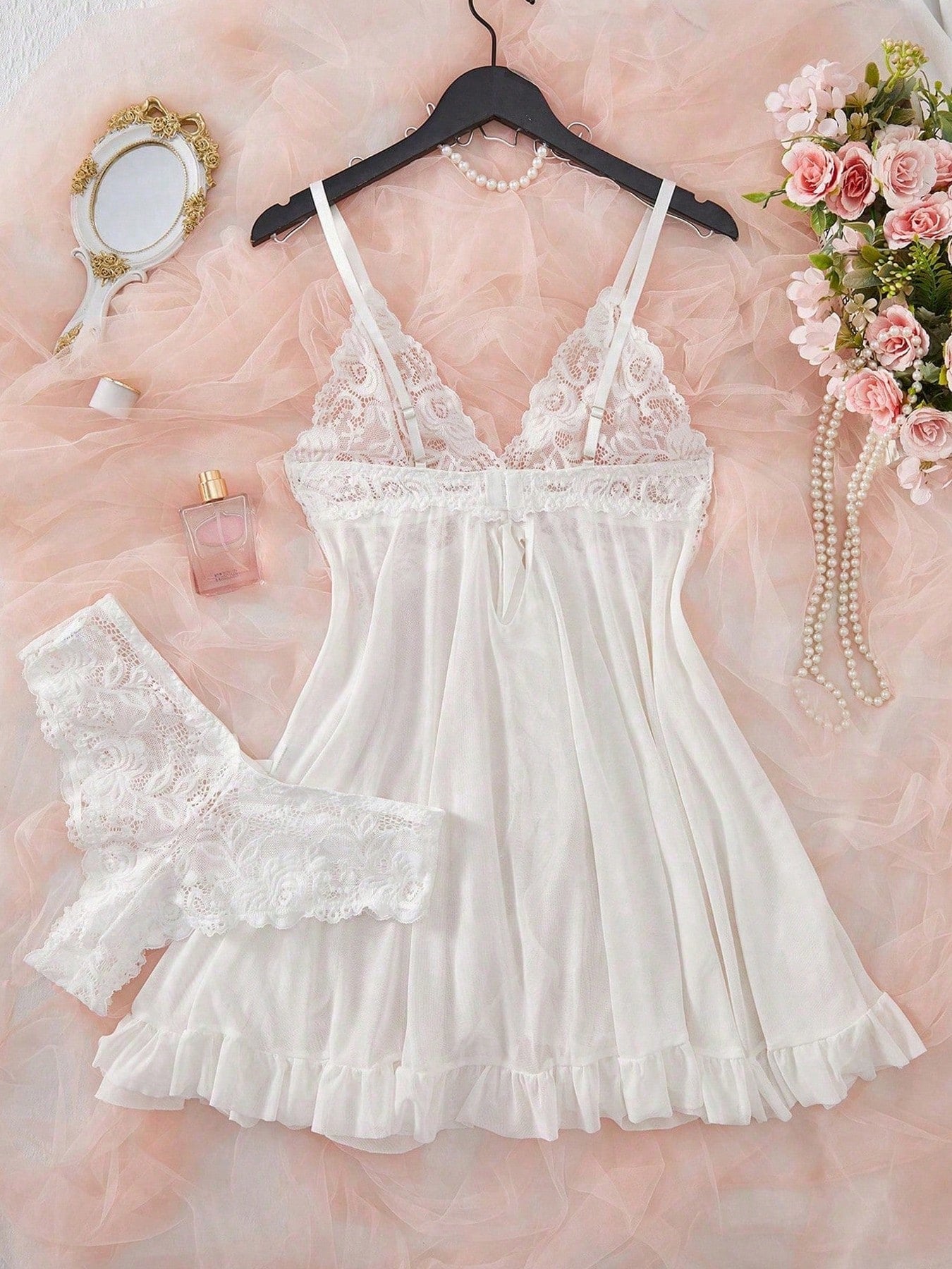 Women's 2-piece sexy lingerie set featuring a deep V sheer contrast lace babydoll bra with adjustable spaghetti straps and matching low-rise briefs; wireless plunge style with short sleeveless romantic design.