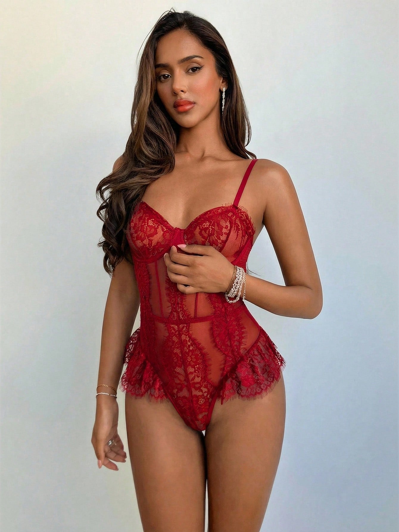 Sleeveless women’s bodysuit with elegant French eyelash lace, cutout waist, and semi-sheer mesh with contrast lace and mesh details; underwire design suitable for wedding bridal lingerie or going-out wear.