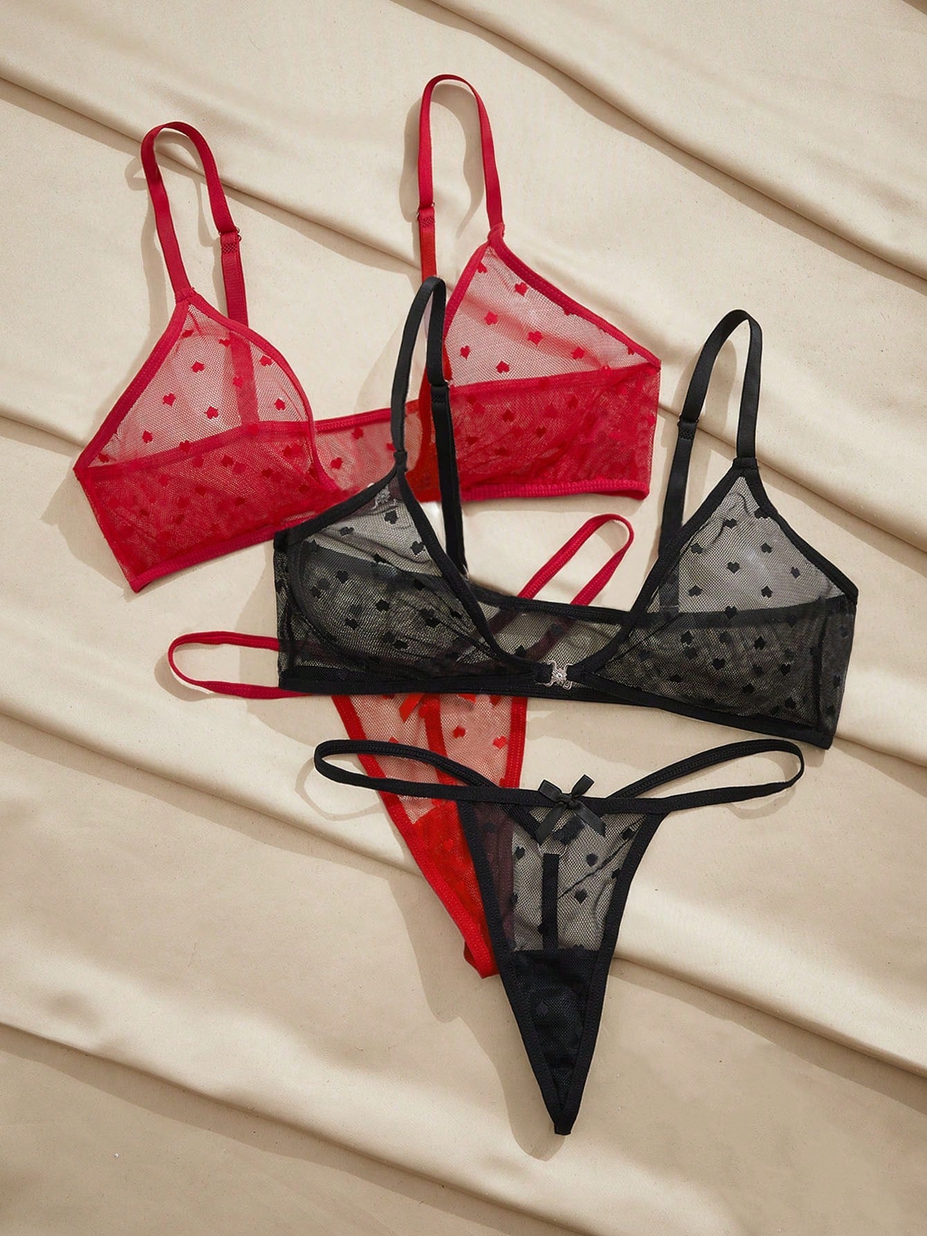 Women’s 2-piece lingerie set with a polka dot mesh bralette featuring a front closure, adjustable straps, lace trim, and a matching low-rise thong.
