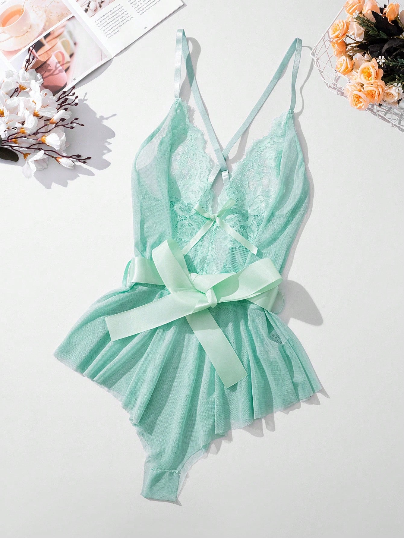 Women’s contrast lace mesh teddy bodysuit lingerie set with bow front detail, ruffle hem, spaghetti straps, and crossback design.