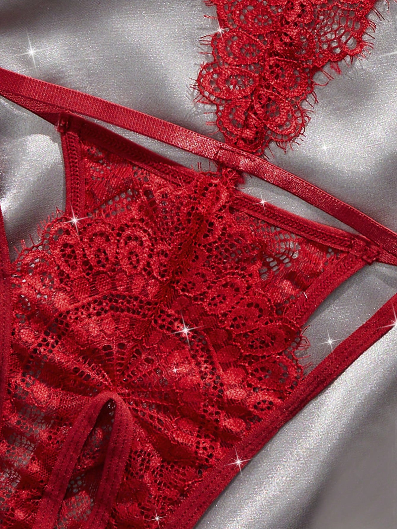 Plain cut-out teddy bodysuit lingerie with bow detail, spaghetti straps, triangle cups, and V-string design.