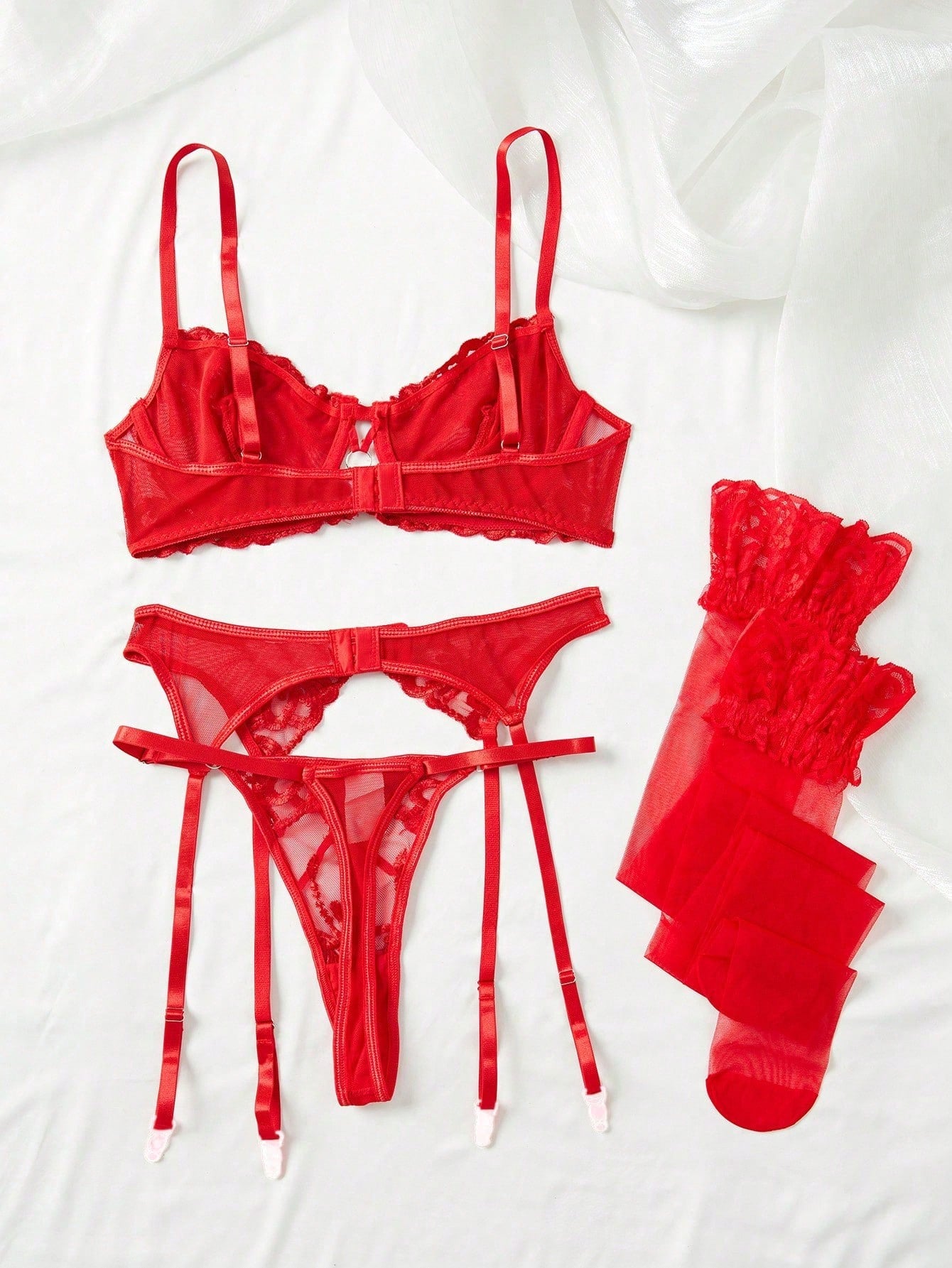 Floral embroidered mesh underwire garter lingerie set with adjustable spaghetti straps, criss-cross detail, and thong panty.