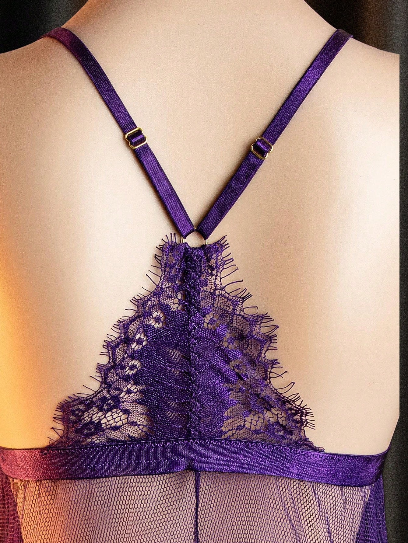 Purple women’s 2-piece lingerie set featuring a spaghetti strap slip dress with crossback detail, hollow-out design, short slit mini length, and matching V-string panty.