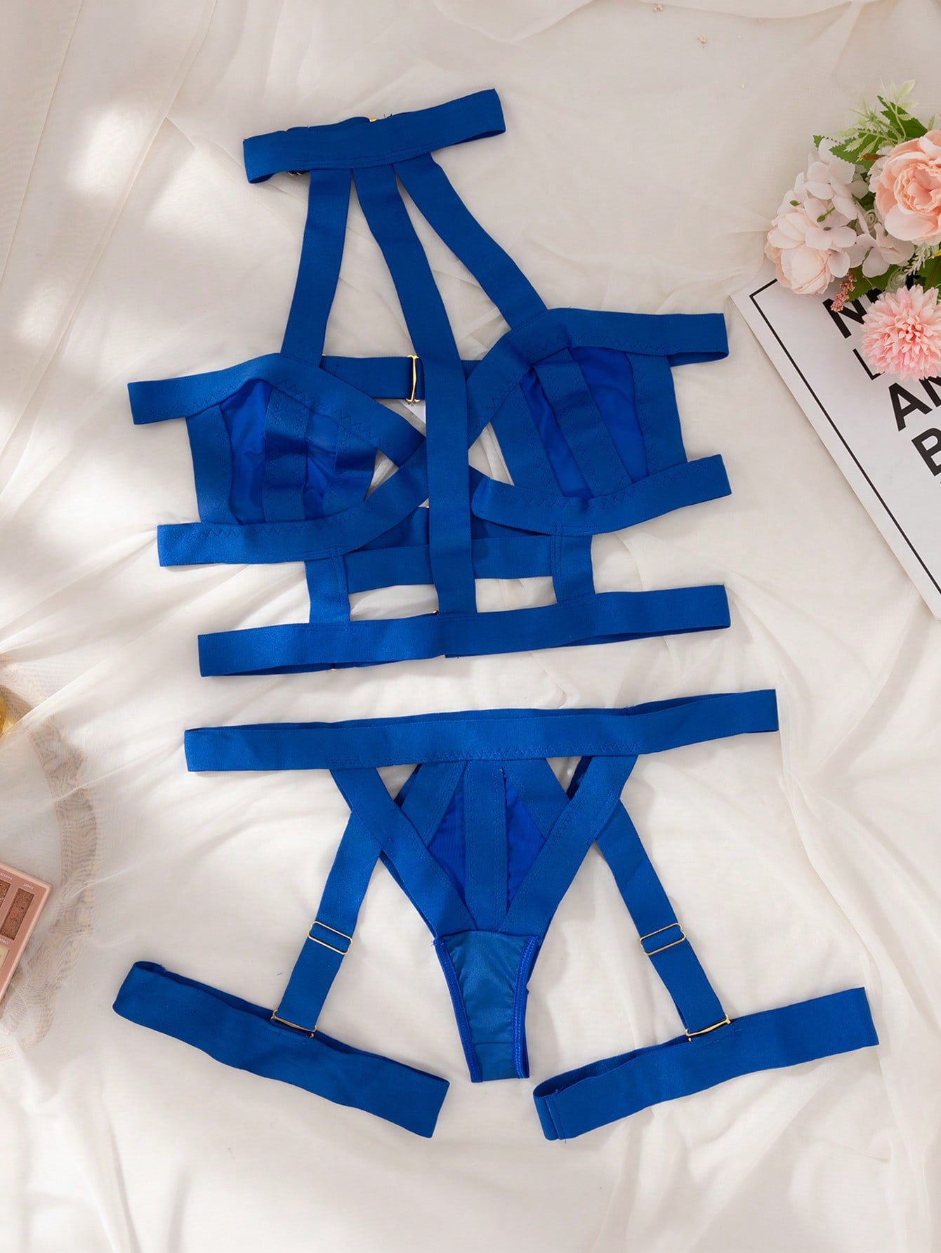 Women’s 4-piece solid cut-out garter lingerie set with halter bralette and thong, includes 1 pair of leg rings; plain ultra-sexy style in slight-stretch fabric, available in red and royal blue.