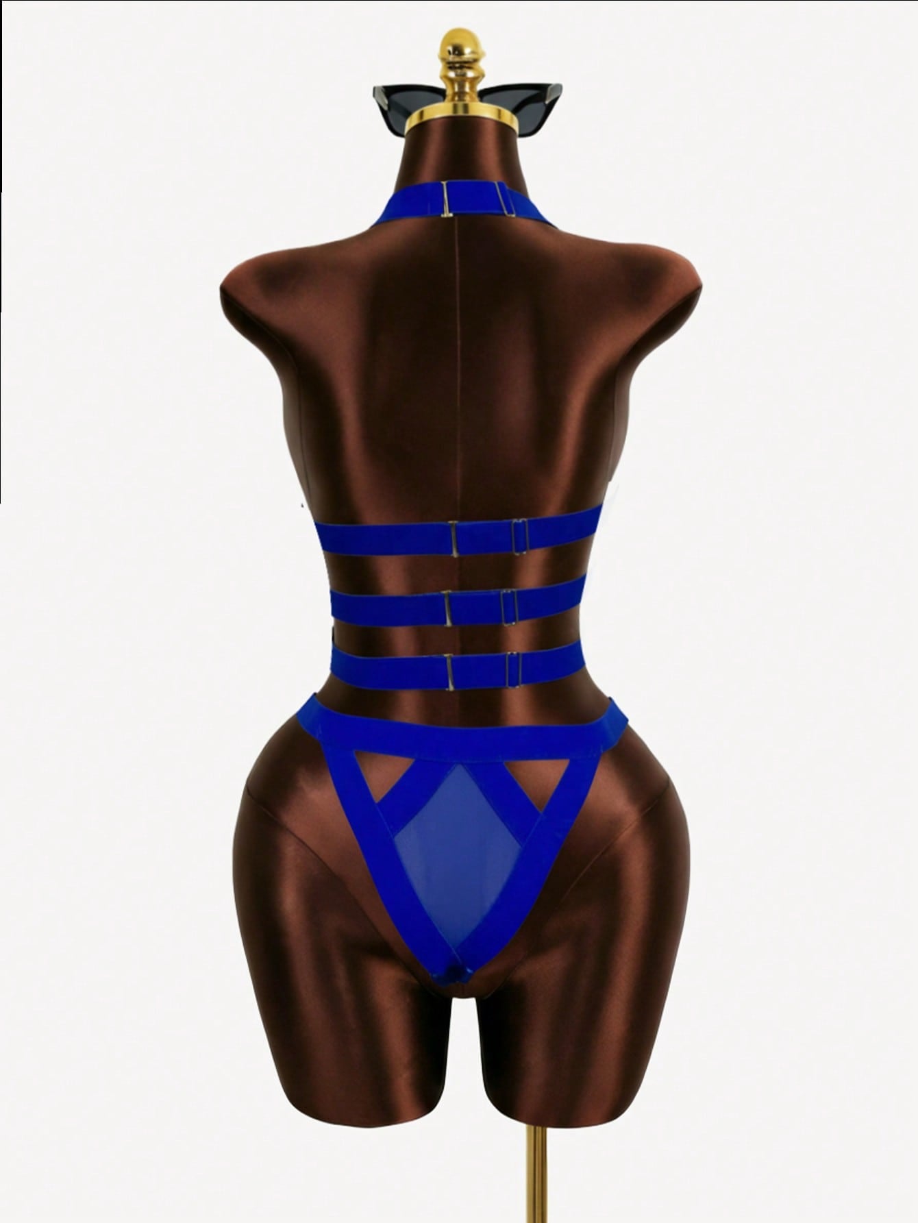 Women’s 4-piece solid cut-out garter lingerie set with halter bralette and thong, includes 1 pair of leg rings; plain ultra-sexy style in slight-stretch fabric, available in red and royal blue.