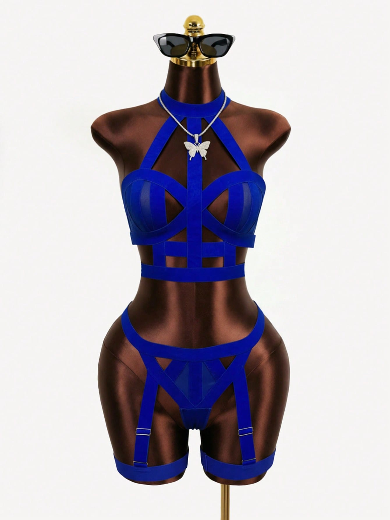 Women’s 4-piece solid cut-out garter lingerie set with halter bralette and thong, includes 1 pair of leg rings; plain ultra-sexy style in slight-stretch fabric, available in red and royal blue.