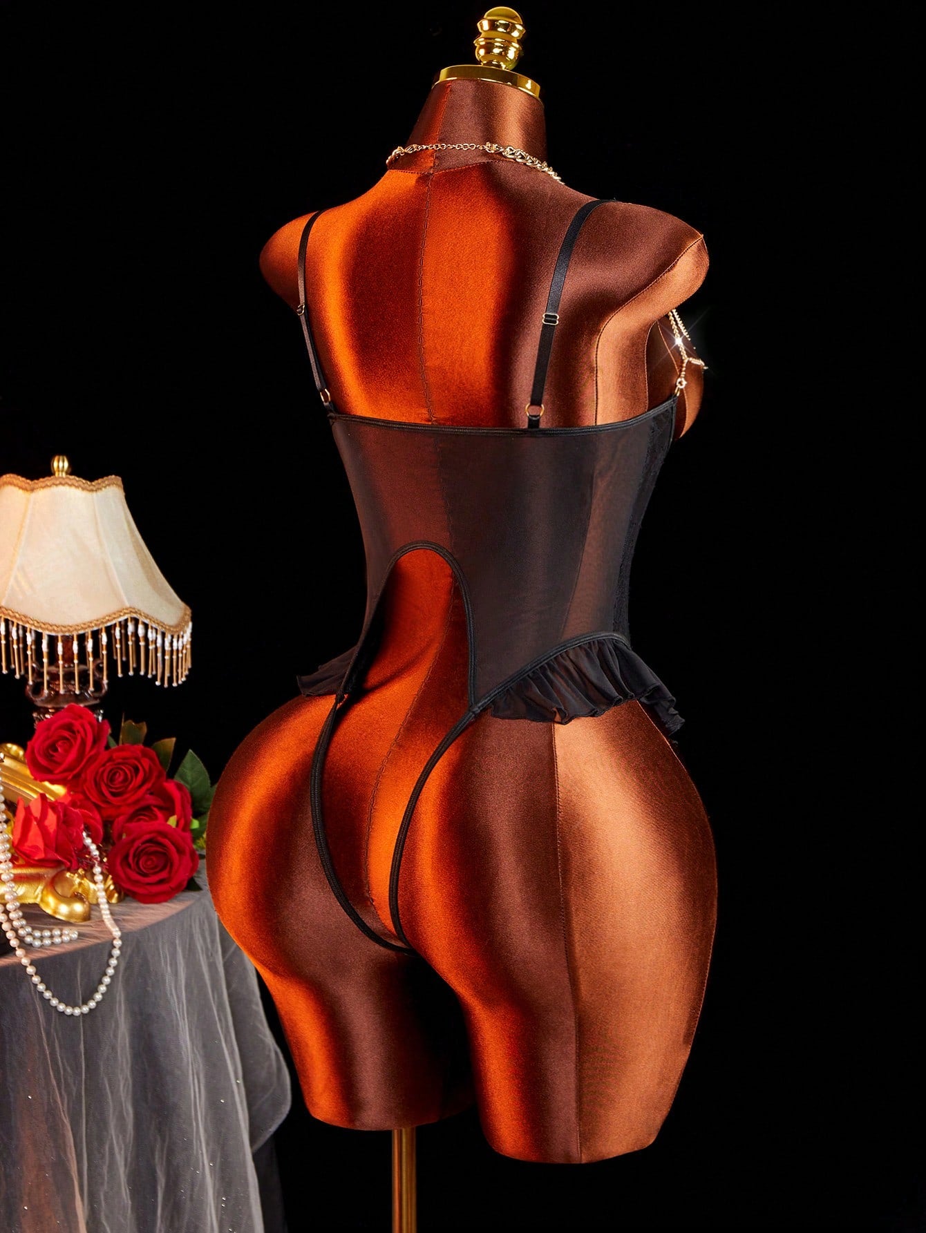 Women’s sexy lingerie bodysuit featuring semi-sheer contrast lace, adjustable spaghetti shoulder straps, heart decor detail, and a ruffle lace crotchless jumpsuit design.