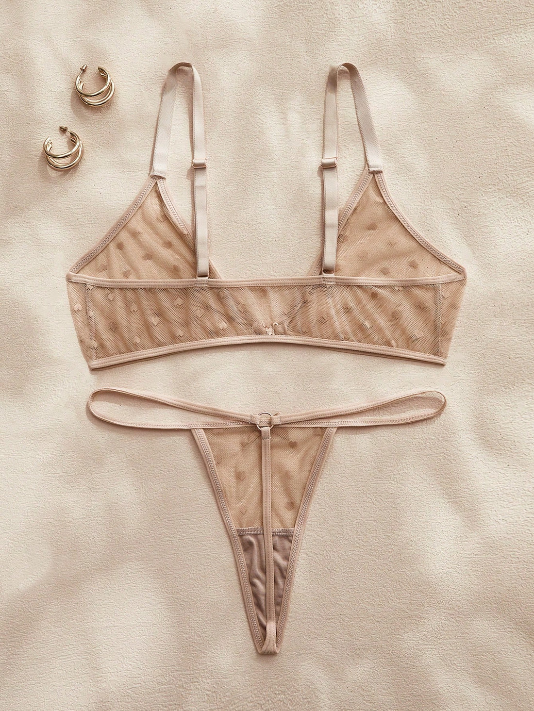 Women’s 2-piece lingerie set with a polka dot mesh bralette featuring a front closure, adjustable straps, lace trim, and a matching low-rise thong.
