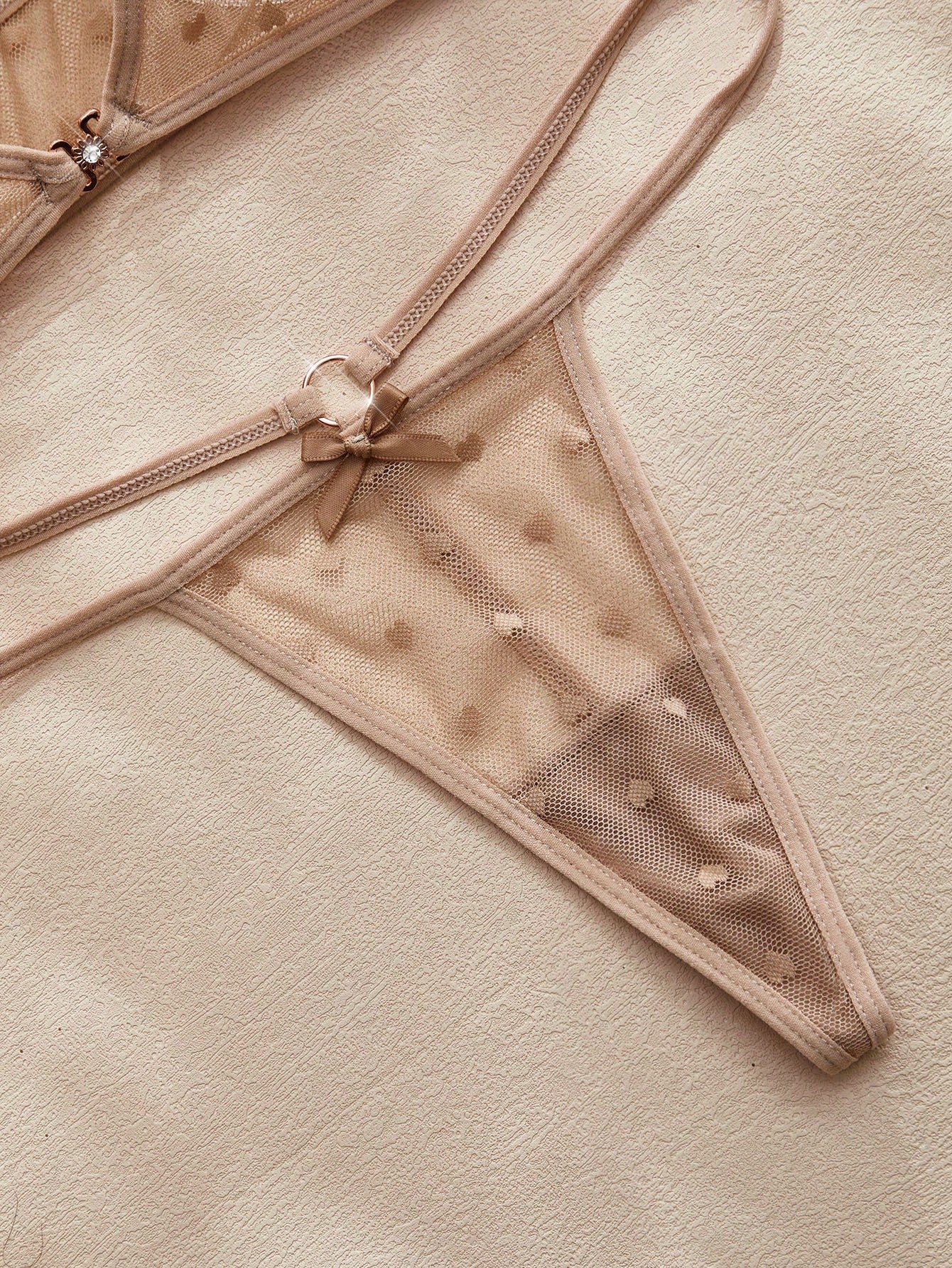 Women’s 2-piece lingerie set with a polka dot mesh bralette featuring a front closure, adjustable straps, lace trim, and a matching low-rise thong.