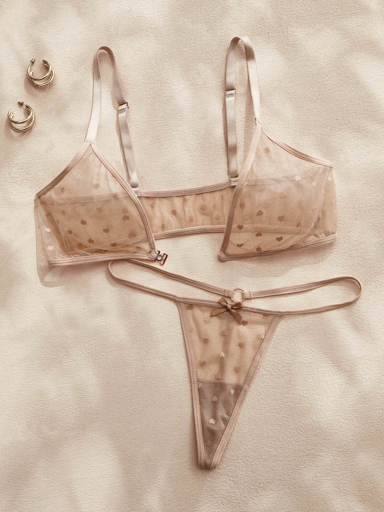 Women’s 2-piece lingerie set with a polka dot mesh bralette featuring a front closure, adjustable straps, lace trim, and a matching low-rise thong.