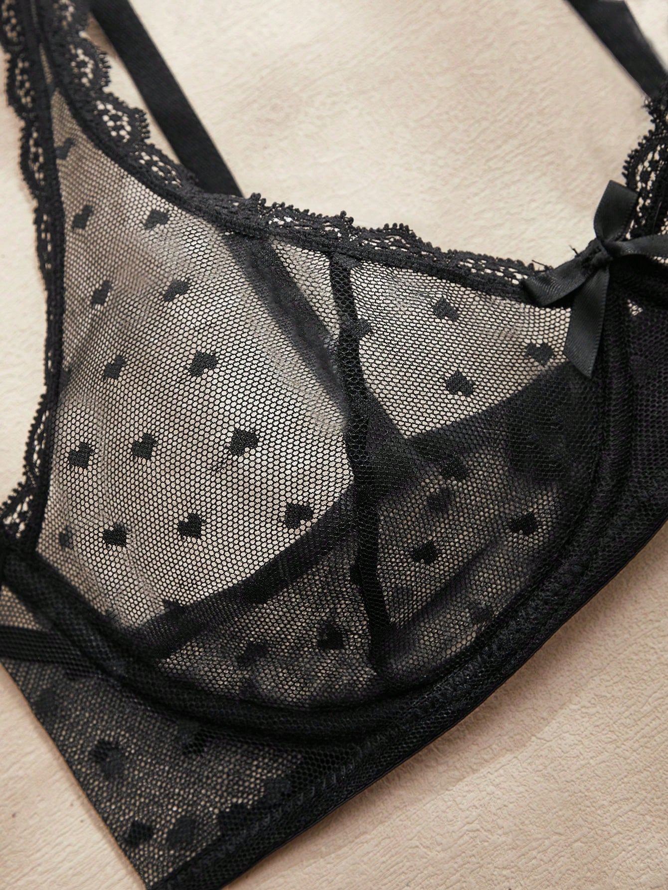 Women's solid color lace bra with sheer unlined design, bow detail, underwire support, and adjustable straps; romantic style push-up bralette for daily wear.