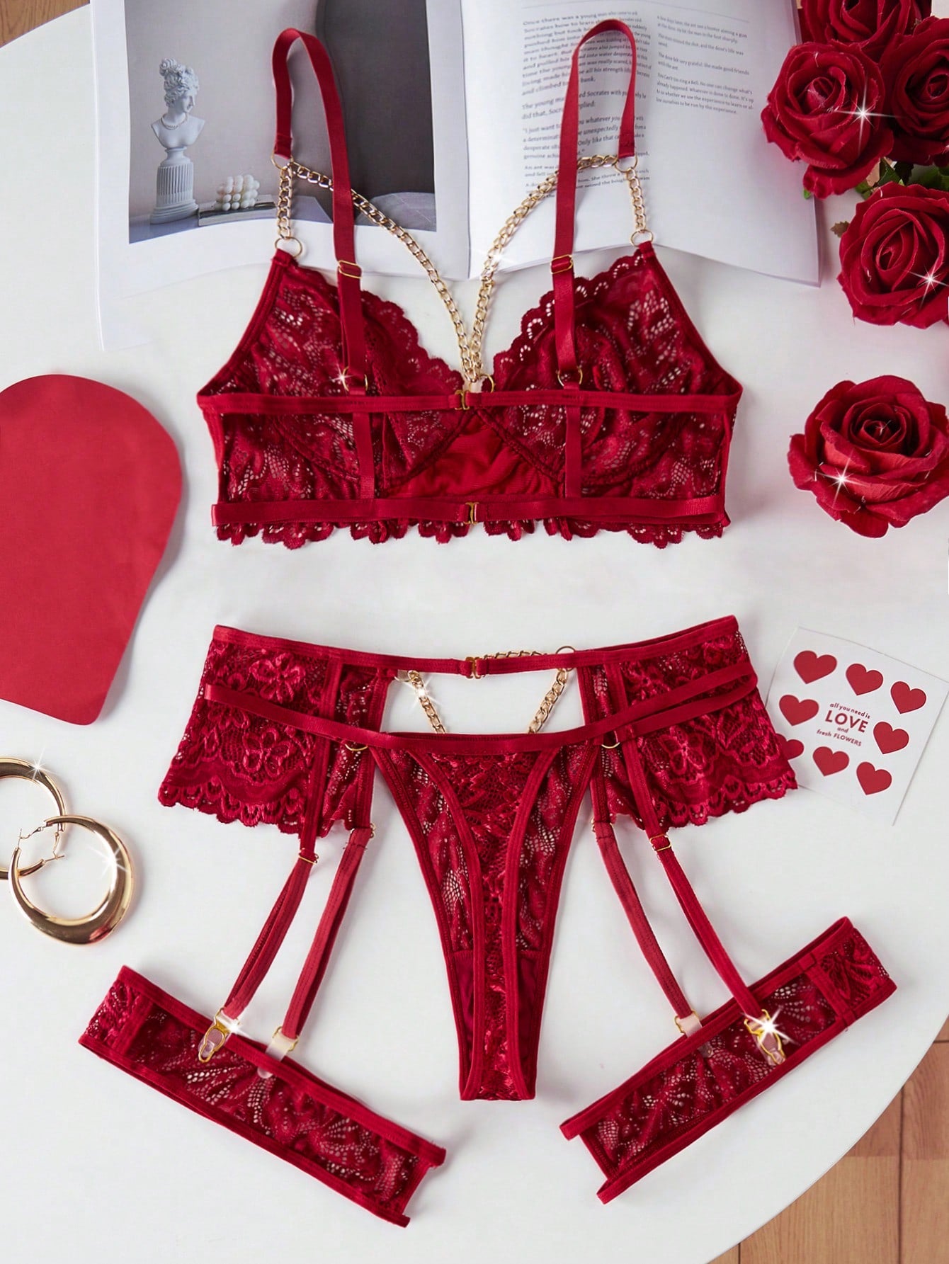 Three-piece women’s sexy lingerie set featuring a front-closure 3/4 cup bra with adjustable straps and decorative detail, an adjustable garter belt, and a thong, with semi-sheer lace accents.