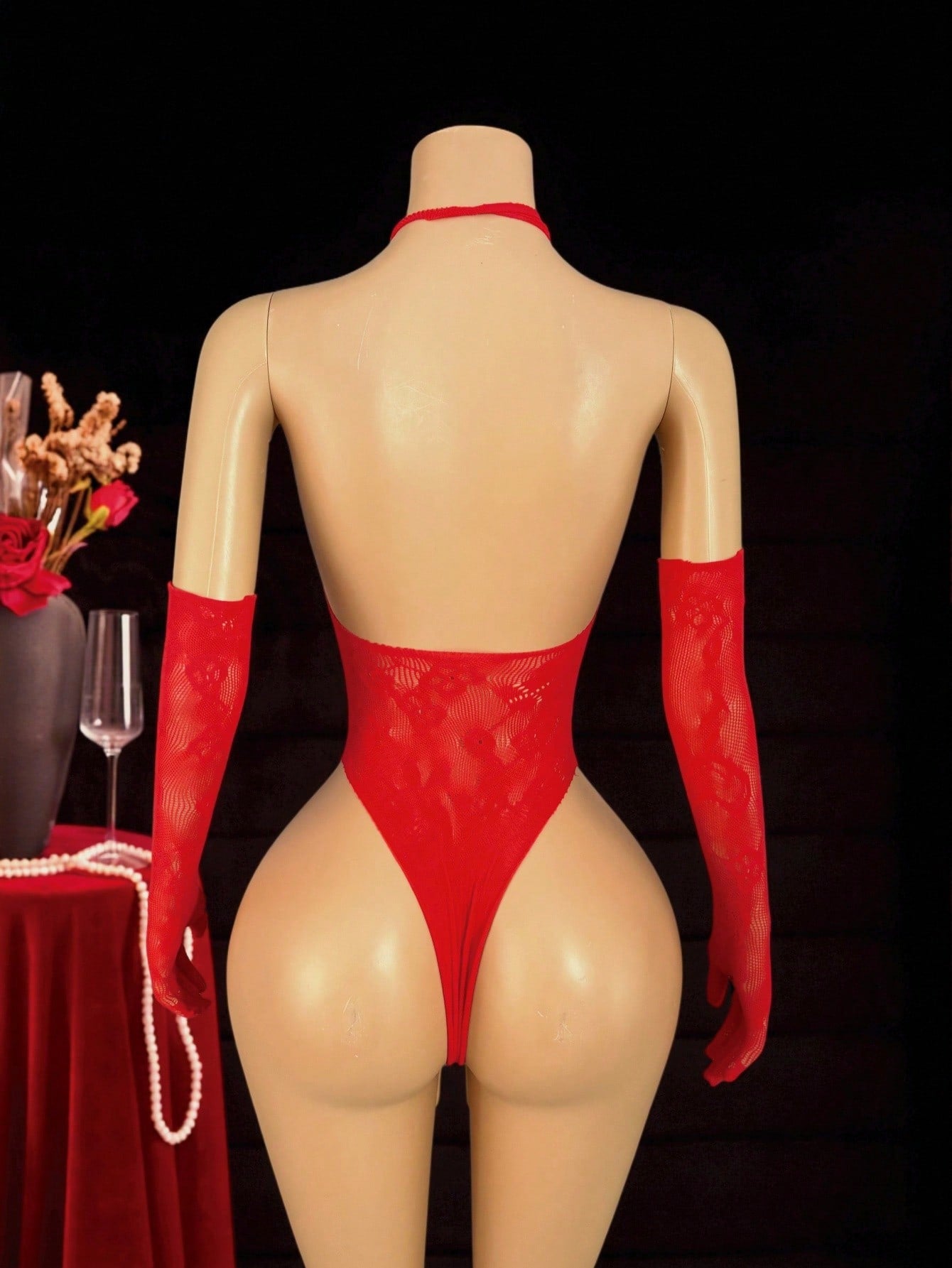Women's 3-piece sexy lingerie set featuring a sheer cut-out bodystocking teddy with halter neckline, strapless styling, underwire 1/2 cup, and matching low-rise thong pieces; available in black or red.