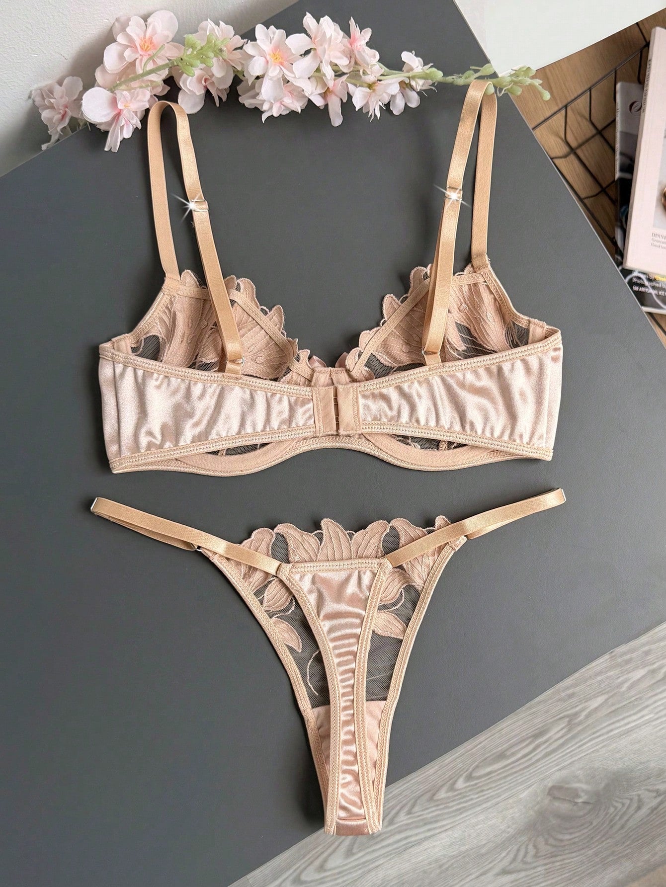 Women’s 2-piece sexy lingerie set featuring an embroidered sheer mesh demi bra with adjustable spaghetti straps and a matching low-rise thong.