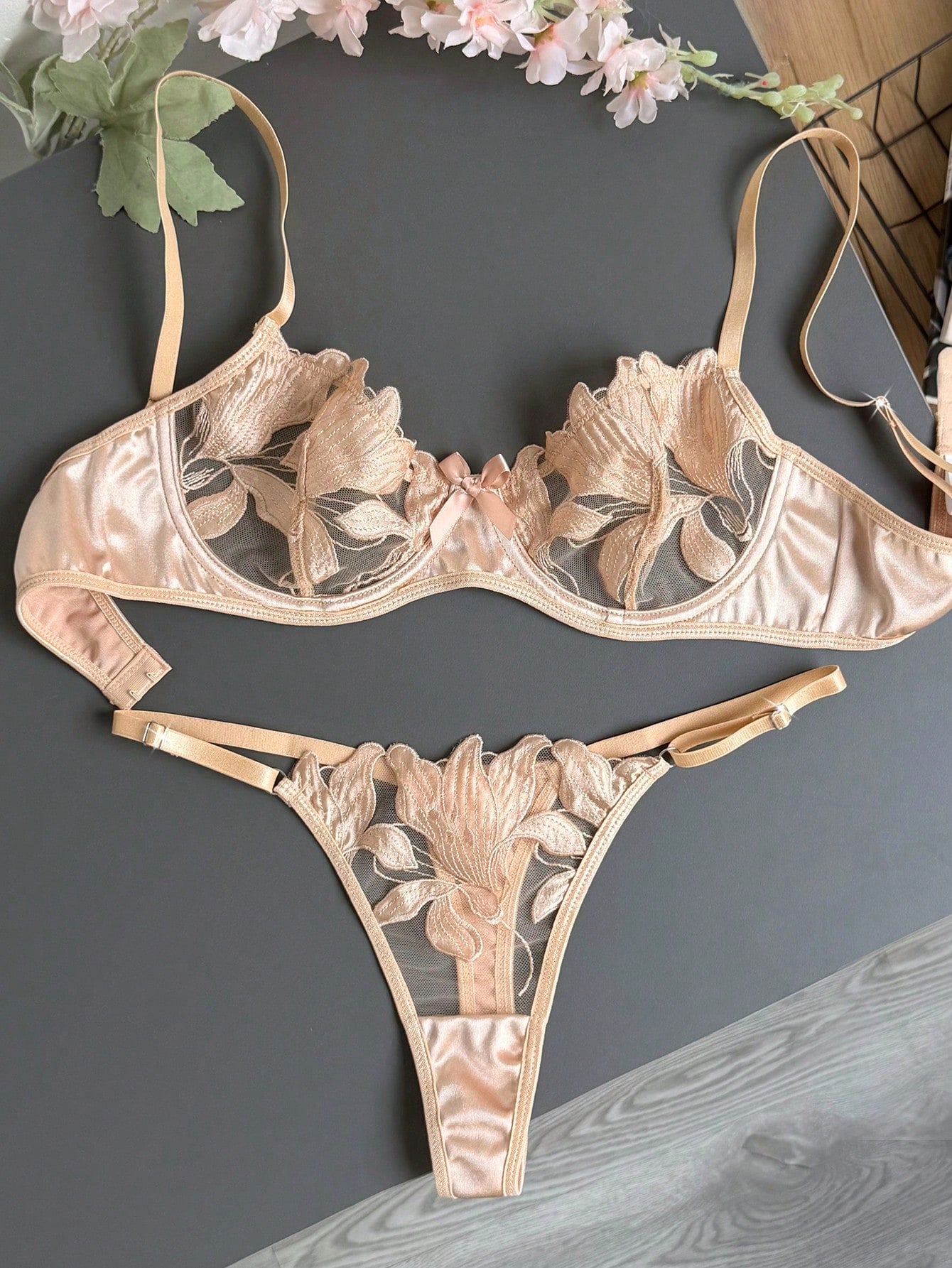 Women’s 2-piece sexy lingerie set featuring an embroidered sheer mesh demi bra with adjustable spaghetti straps and a matching low-rise thong.