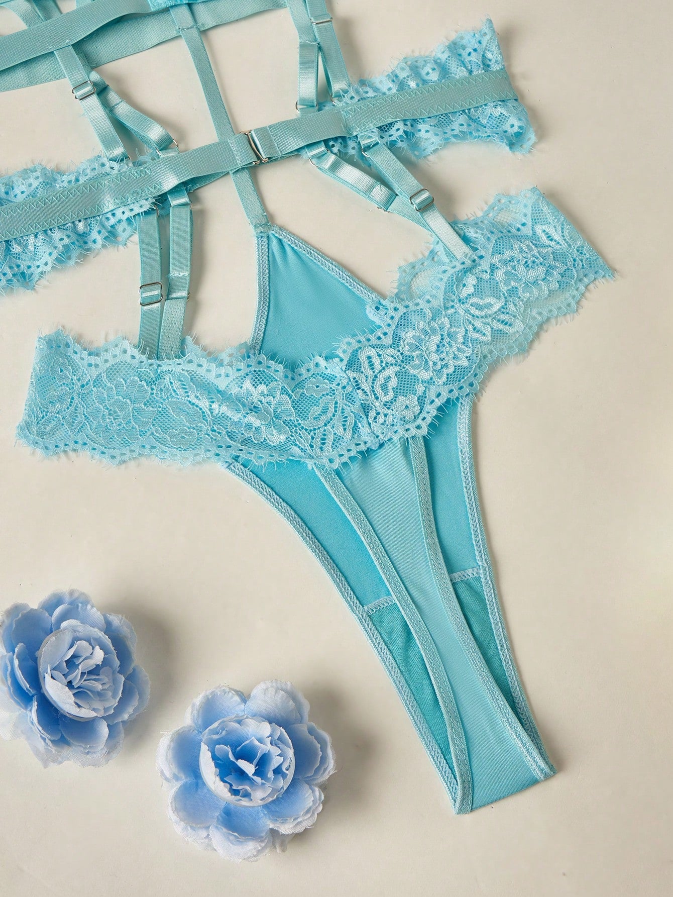 Women's semi-sheer lace bodysuit lingerie with contrast lace and cut-out detail, spaghetti straps, and a thong-style high-rise design. Wireless full-cup fit with medium stretch, suitable for going out or private party wear.