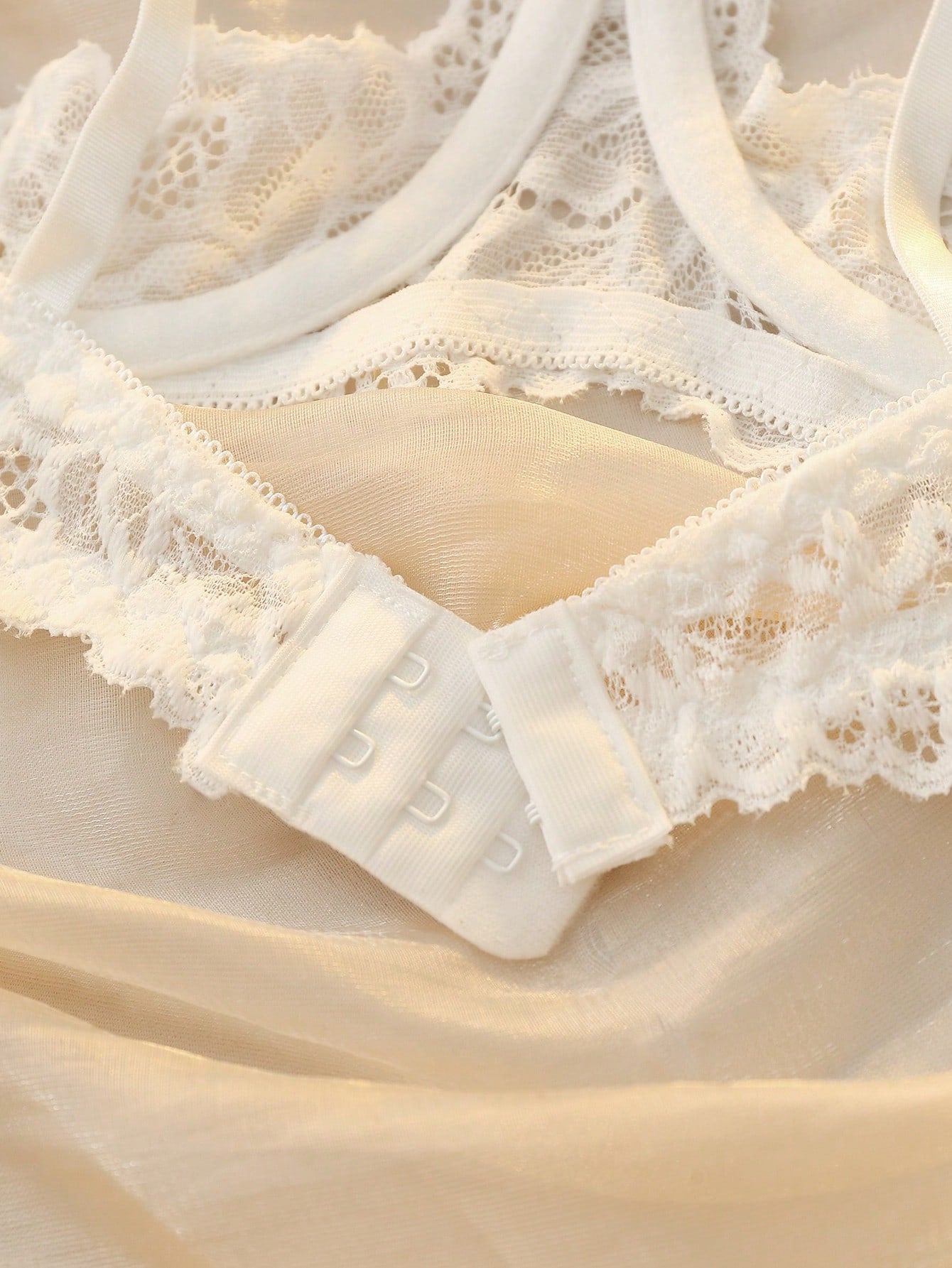 Women’s 2-piece contrast lace lingerie set with a sheer plain design, featuring an underwire open-cup bra with adjustable spaghetti straps and matching low-rise V-string panties.