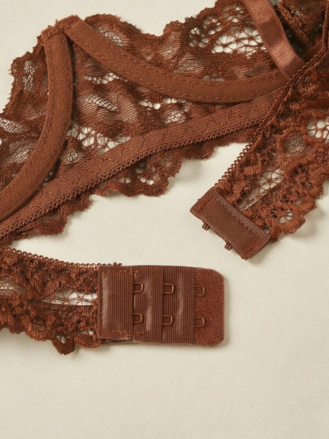 Women’s 2-piece contrast lace lingerie set with a sheer plain design, featuring an underwire open-cup bra with adjustable spaghetti straps and matching low-rise V-string panties.