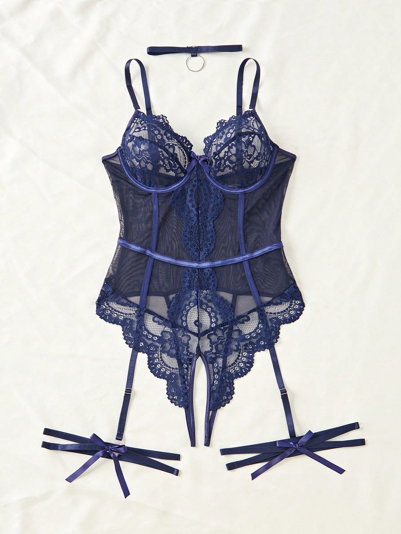 4-piece women’s lingerie set featuring a lace contrast mesh bodysuit with underwire, cut-out details, adjustable spaghetti straps, matching thong, and leg garters.