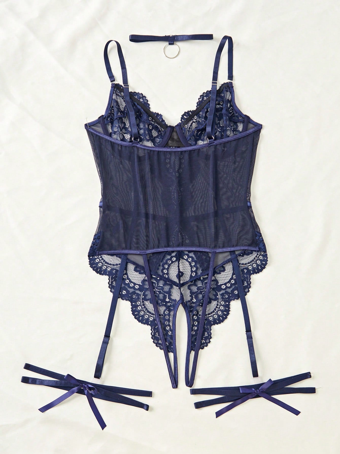 4-piece women’s lingerie set featuring a lace contrast mesh bodysuit with underwire, cut-out details, adjustable spaghetti straps, matching thong, and leg garters.