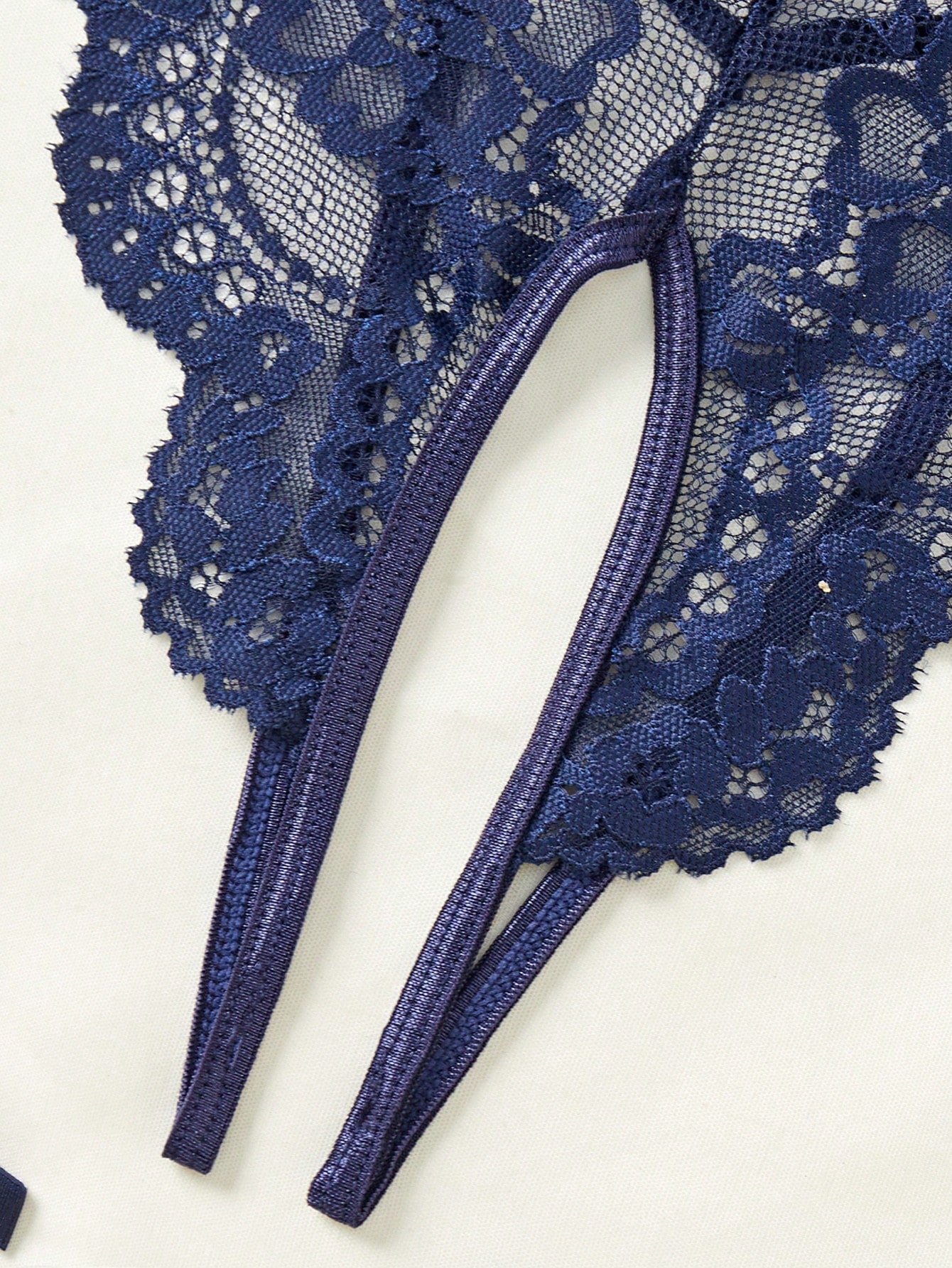 4-piece women’s lingerie set featuring a lace contrast mesh bodysuit with underwire, cut-out details, adjustable spaghetti straps, matching thong, and leg garters.