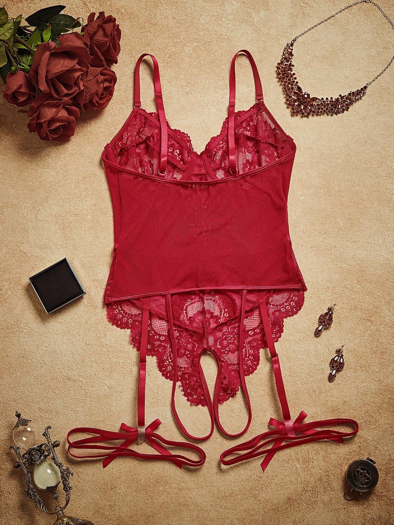 4-piece women’s lingerie set featuring a lace contrast mesh bodysuit with underwire, cut-out details, adjustable spaghetti straps, matching thong, and leg garters.