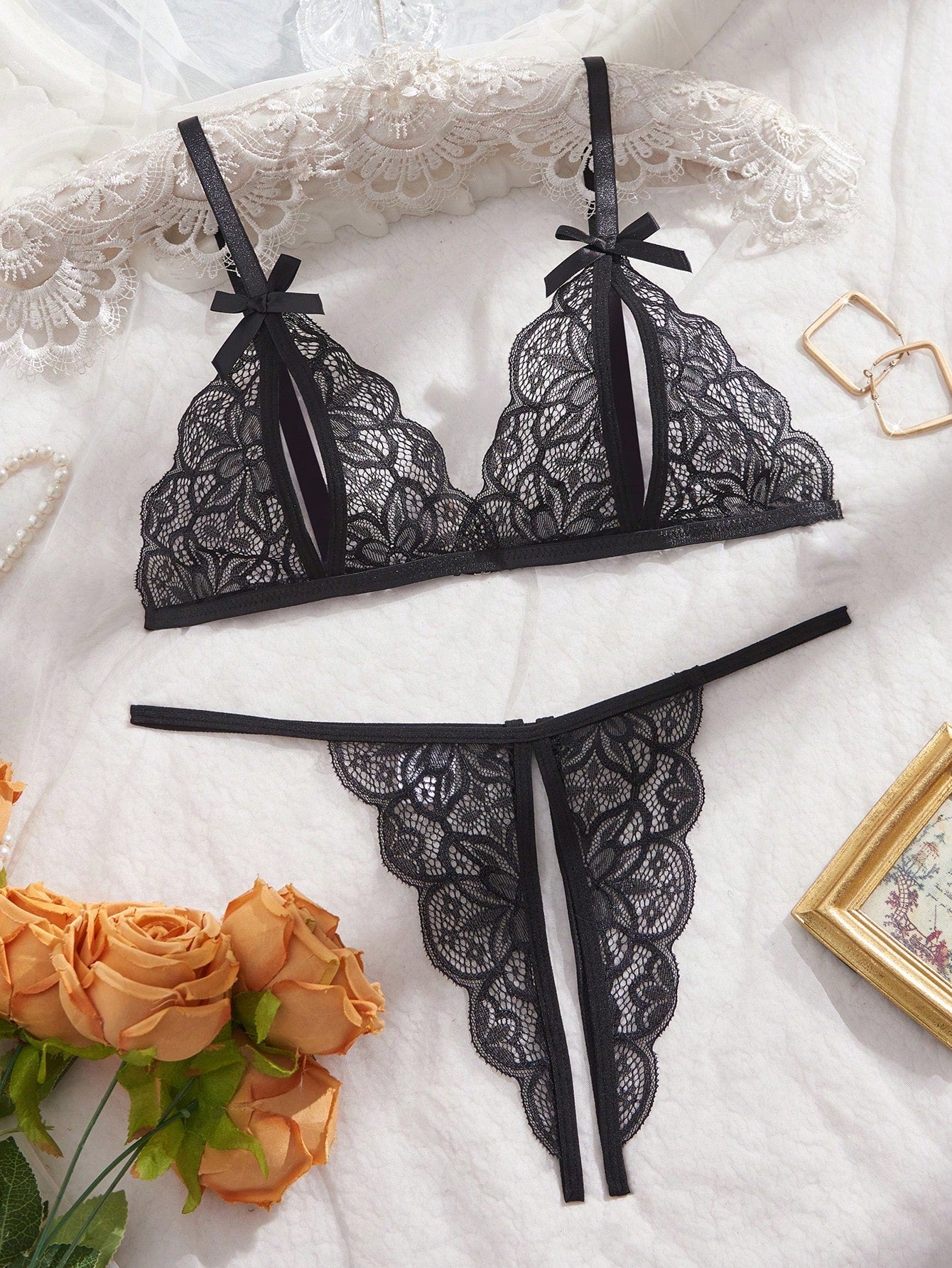 Two-piece women’s sexy lingerie set with a wireless bralette and T-back V-string panties, featuring bowknot decoration, hollow-out detailing, and contrast lace accents with adjustable spaghetti straps.