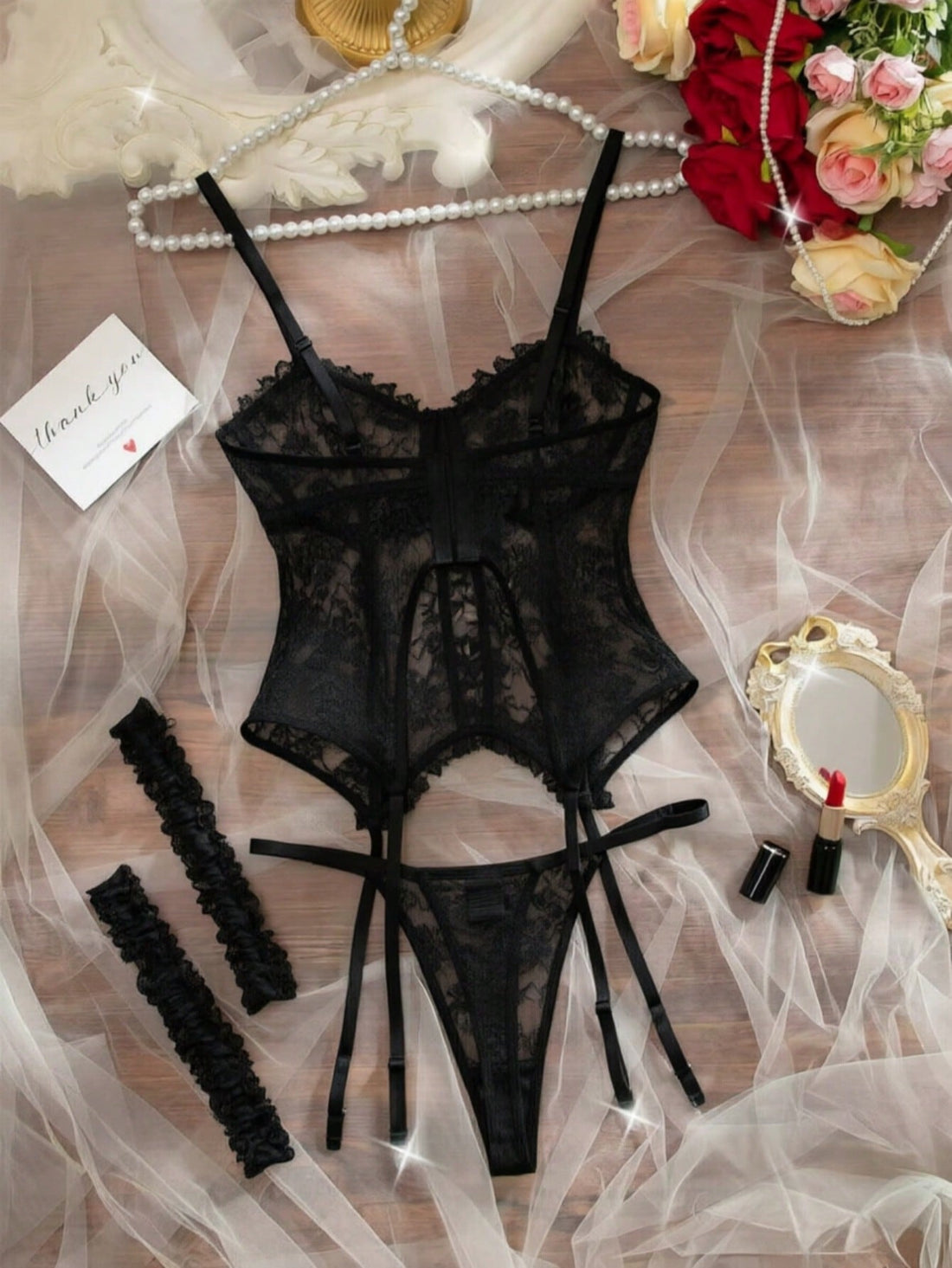 Women’s sexy lace lingerie set with lace-trim blouse top, matching panty thong, and garter details; sheer hollow-out style with adjustable spaghetti straps and bow accents.