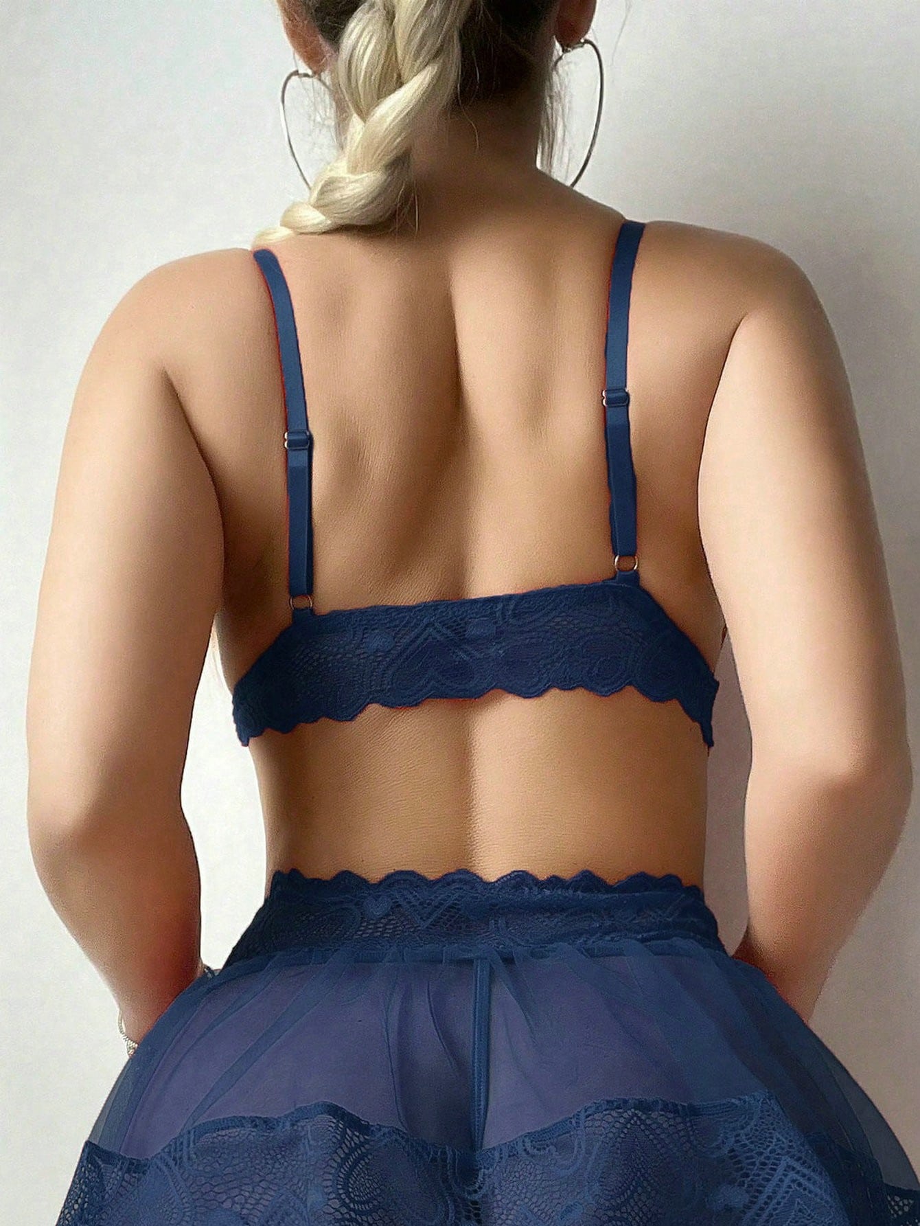Women’s 5-piece sexy lingerie set featuring contrast lace and mesh details, including a wireless bra with adjustable spaghetti straps, a low-rise G-string thong, a short skirt, and two mesh stockings.