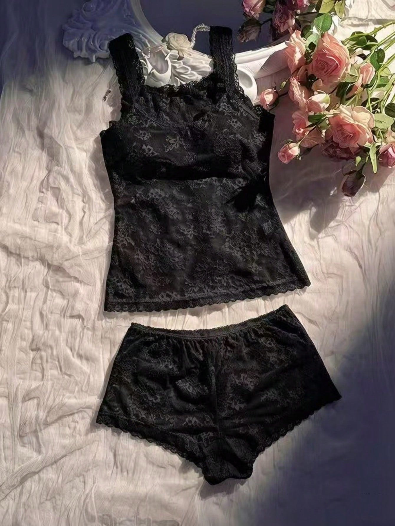 Women’s 2-piece sheer lace lingerie set featuring a camisole-style wireless bra with non-adjustable straps and matching low-rise boyshorts.