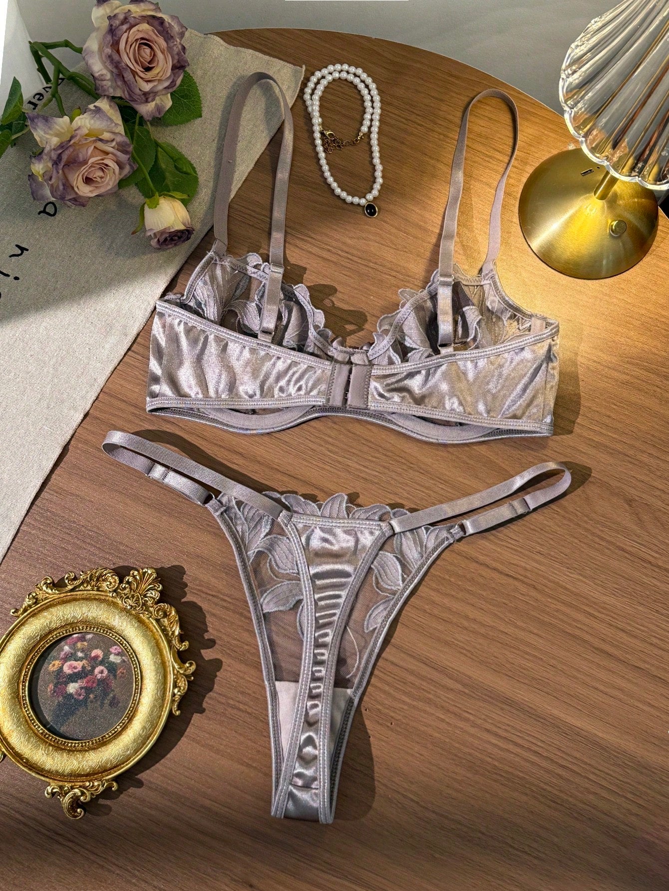 Women’s 2-piece sexy lingerie set featuring an embroidered sheer mesh demi bra with adjustable spaghetti straps and a matching low-rise thong.